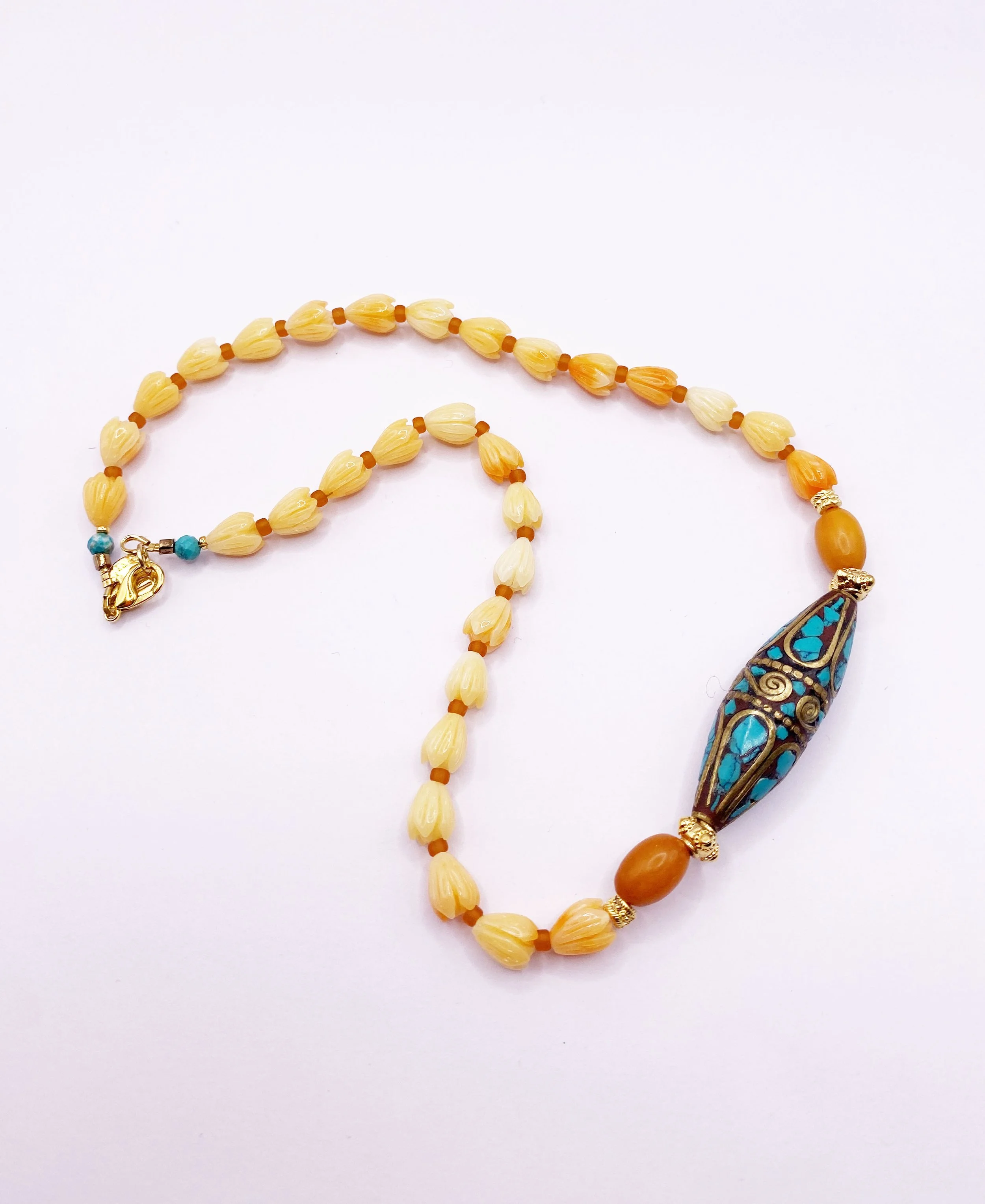 one off turquoise and flower.jpg