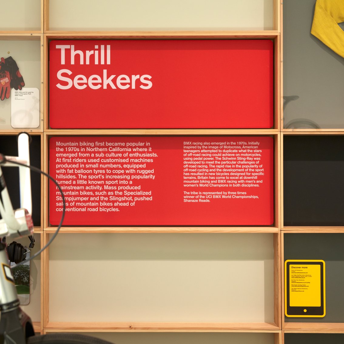 Red information board with heading Thrill Seekers and text in light pink
