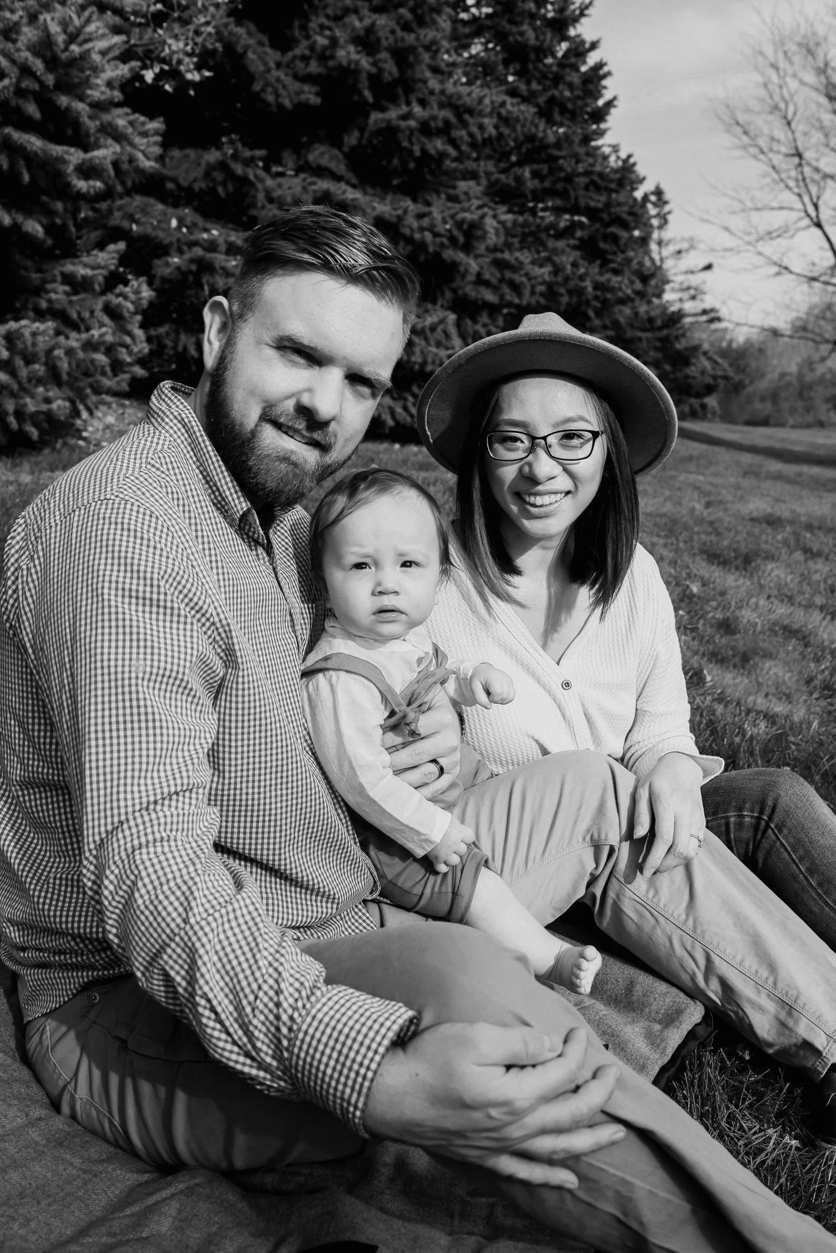Backyard photography session for family of three in Grandville, Michigan by photographer Randi Armstrong.