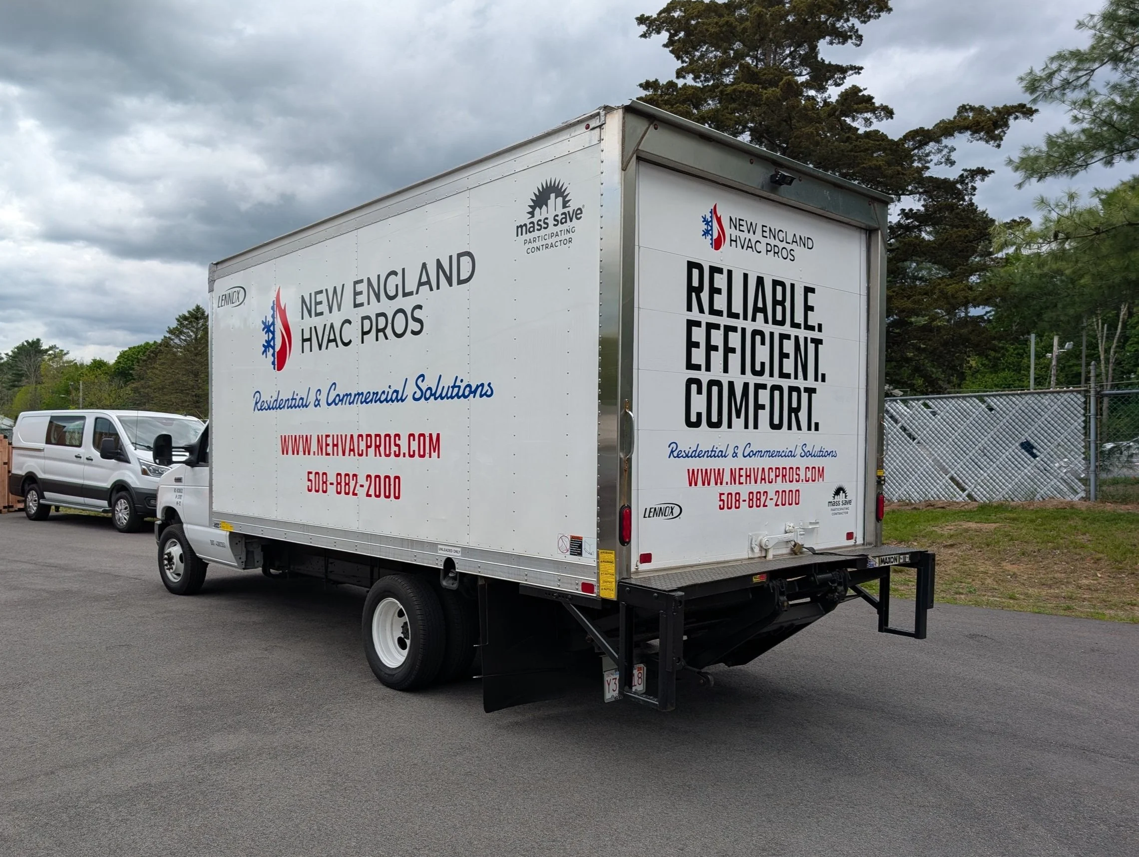 Truck advertising New England HVAC Pros with slogans Reliable, Efficient, Comfort. Phone number and website listed.