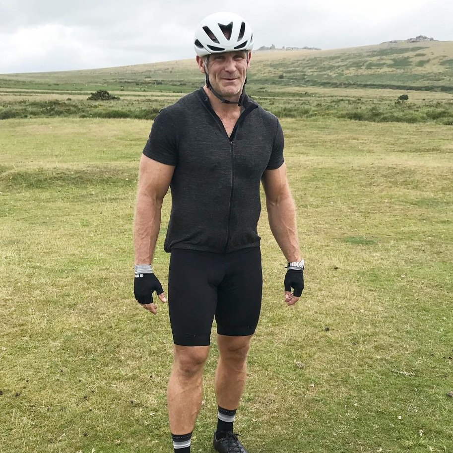 Male masters athlete over 50 in cycling gear smiling
