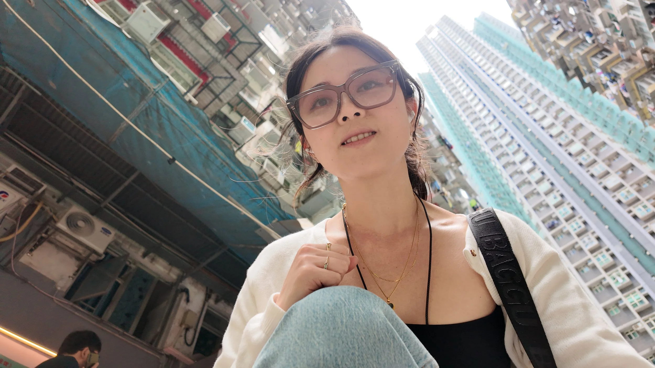 Young woman at the monster building in Hong Kong
