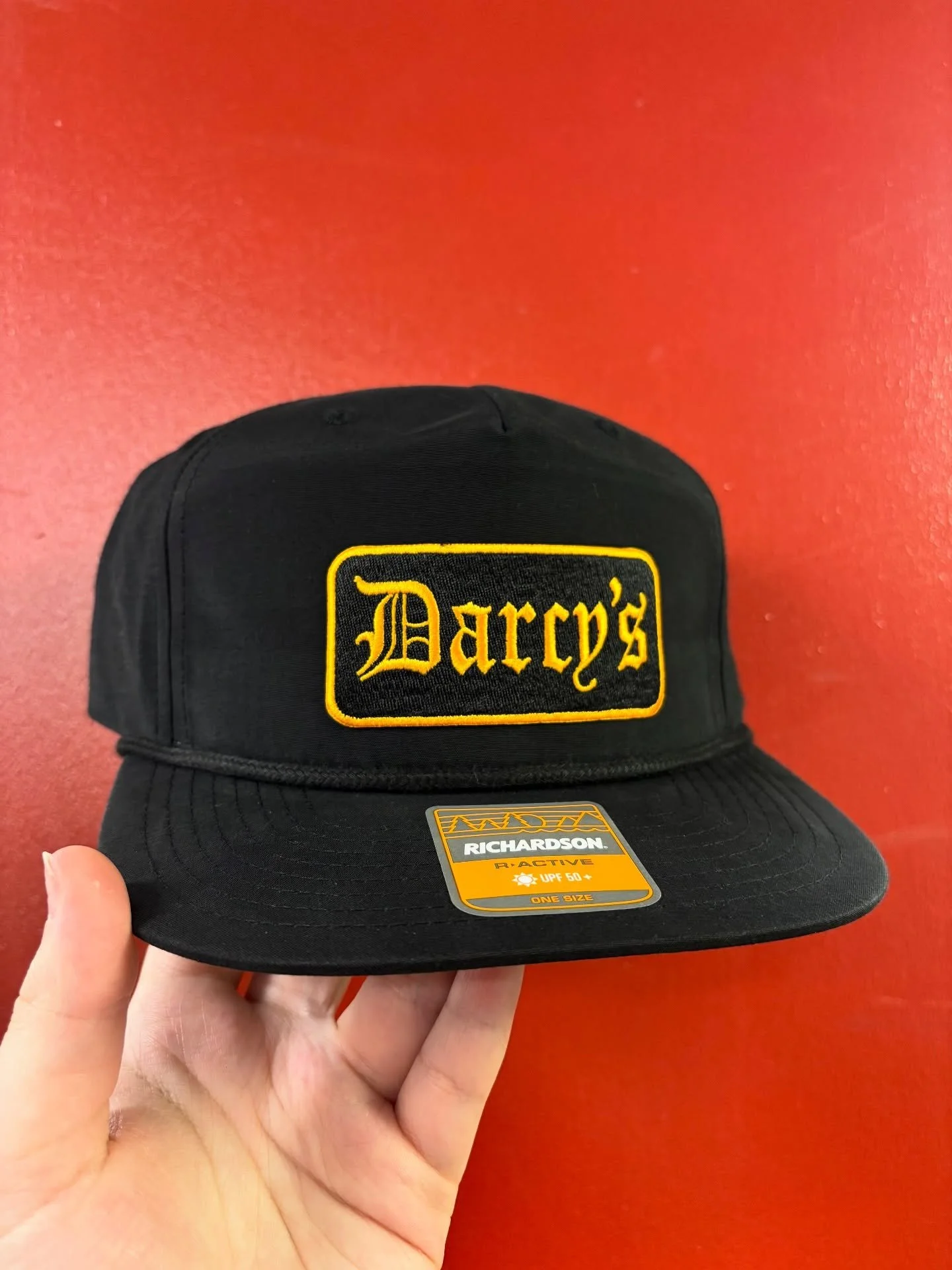 This orange and black embroidered patch for Darcy&rsquo;s Village Pub really pops!
&bull;
&bull;
&bull;
#embroidery #patchhats #stpatricksday2026☘️🌈🎩 #supportsmallbusinesses #shoplocal