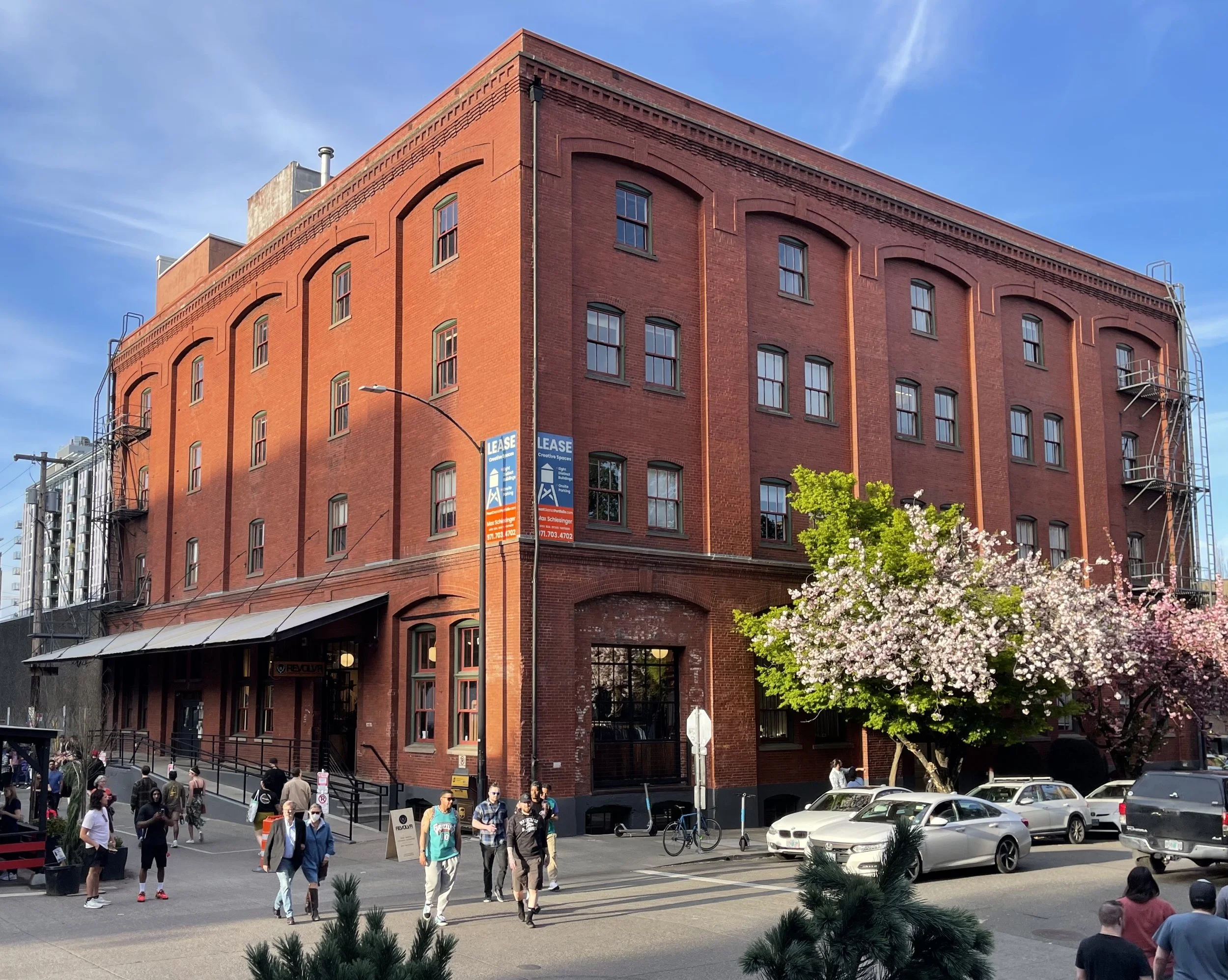 Maddox Building spring with blossoms and people