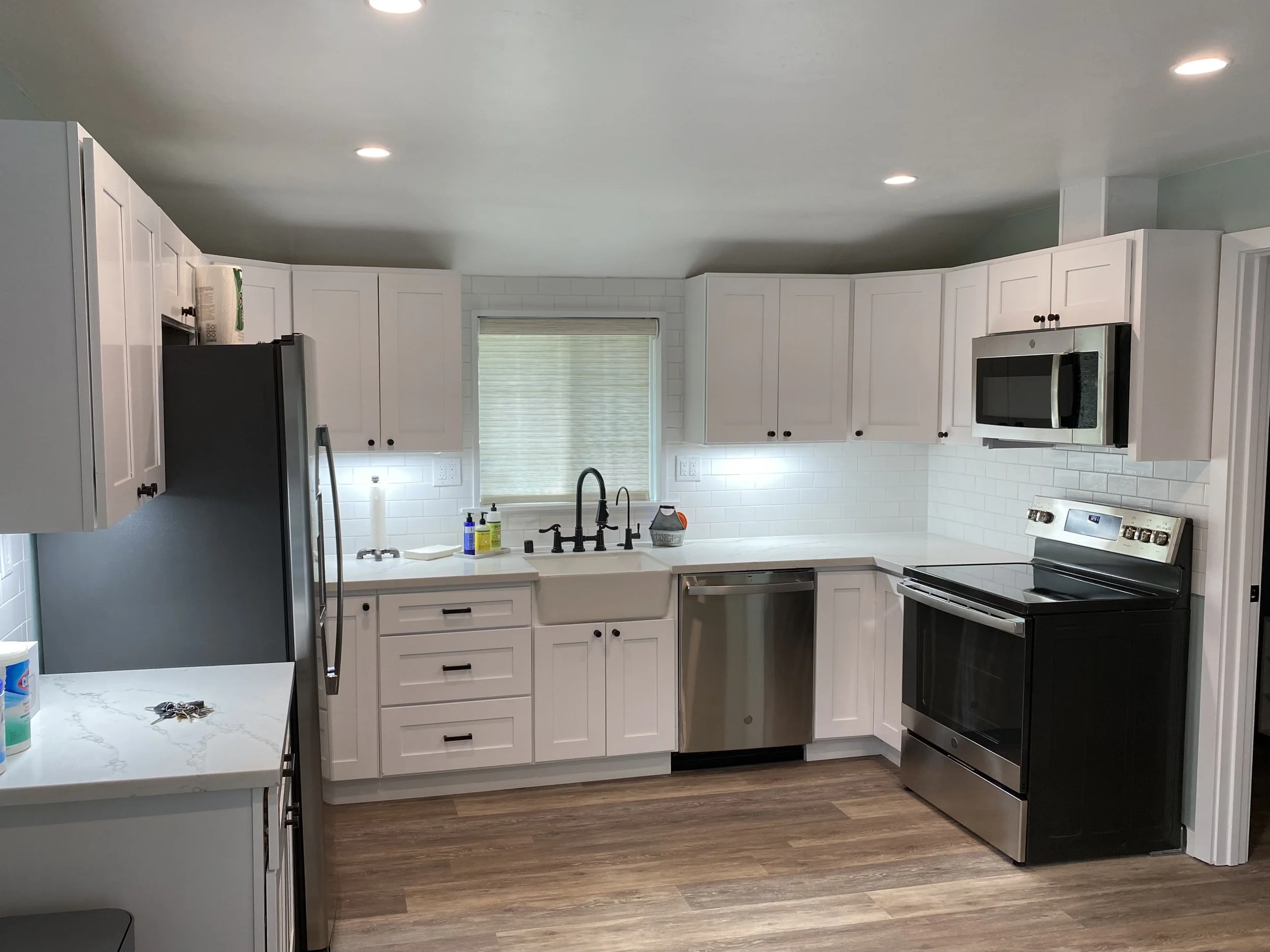 This kitchen was part of a complete ADU remodel. This included installing classic shaker cabinets and subway tile as well as new LVT flooring. 