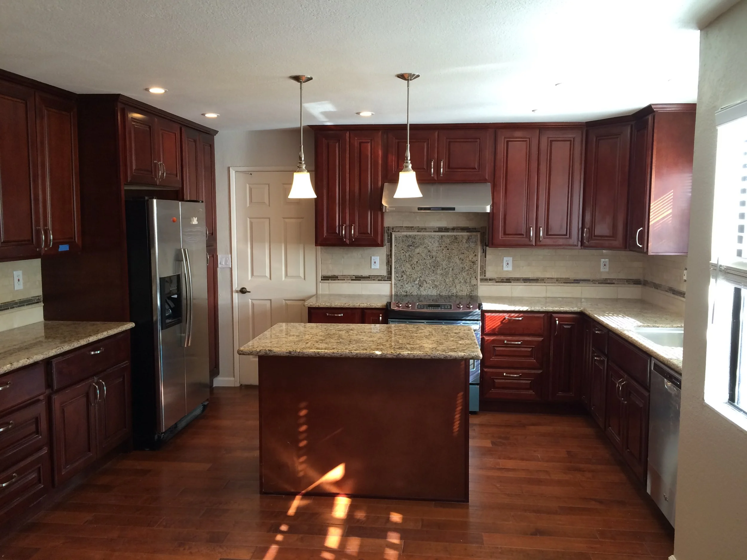 This was originally a separate kitchen and dining room that we turned into a modern large  eat-in kitchen. 