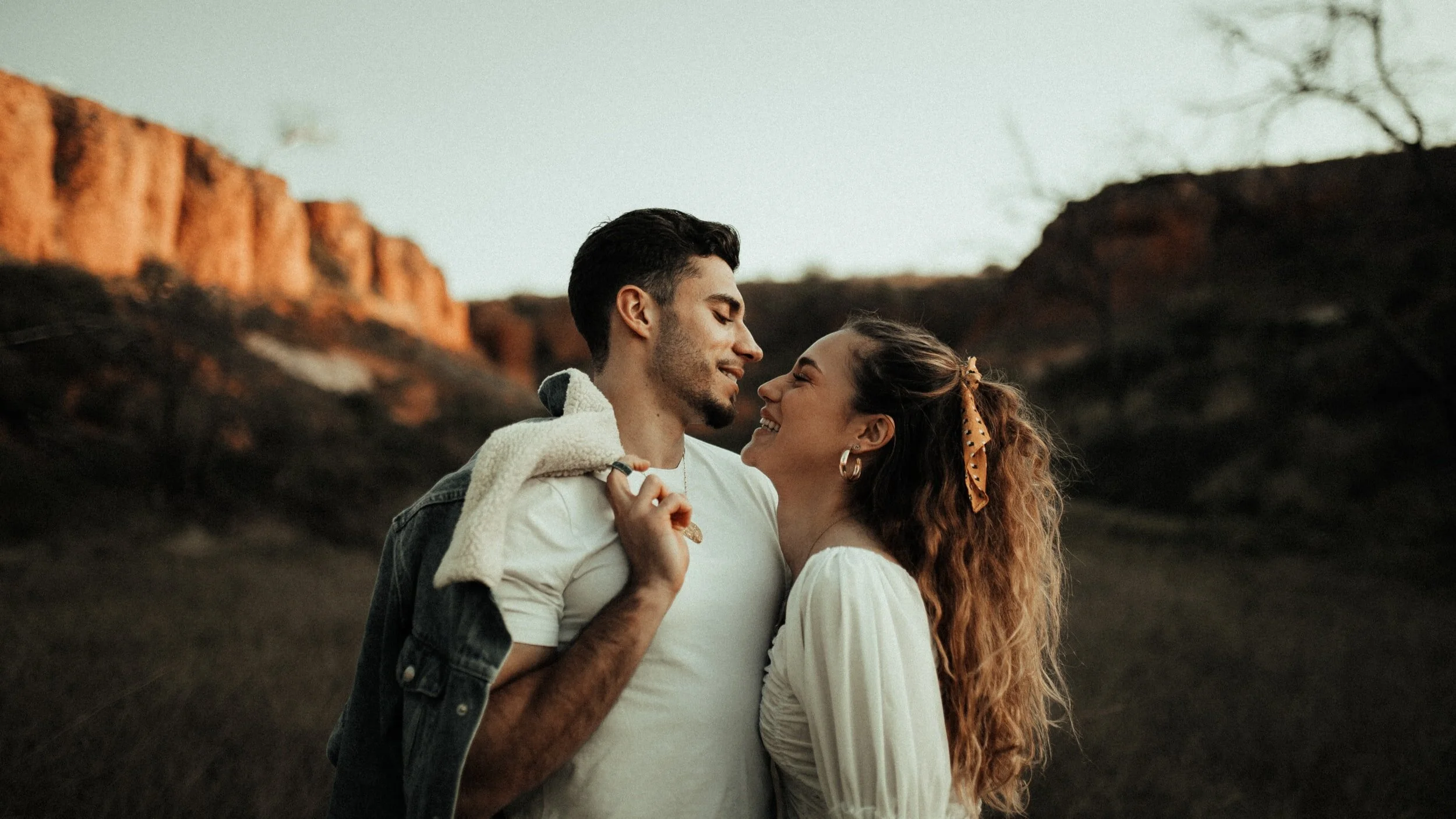  Couple laugh together after attending couples counseling in Miami with a couples therapist in miami who is a miami therapist and psychologist in miami who offers counseling in Miami. 