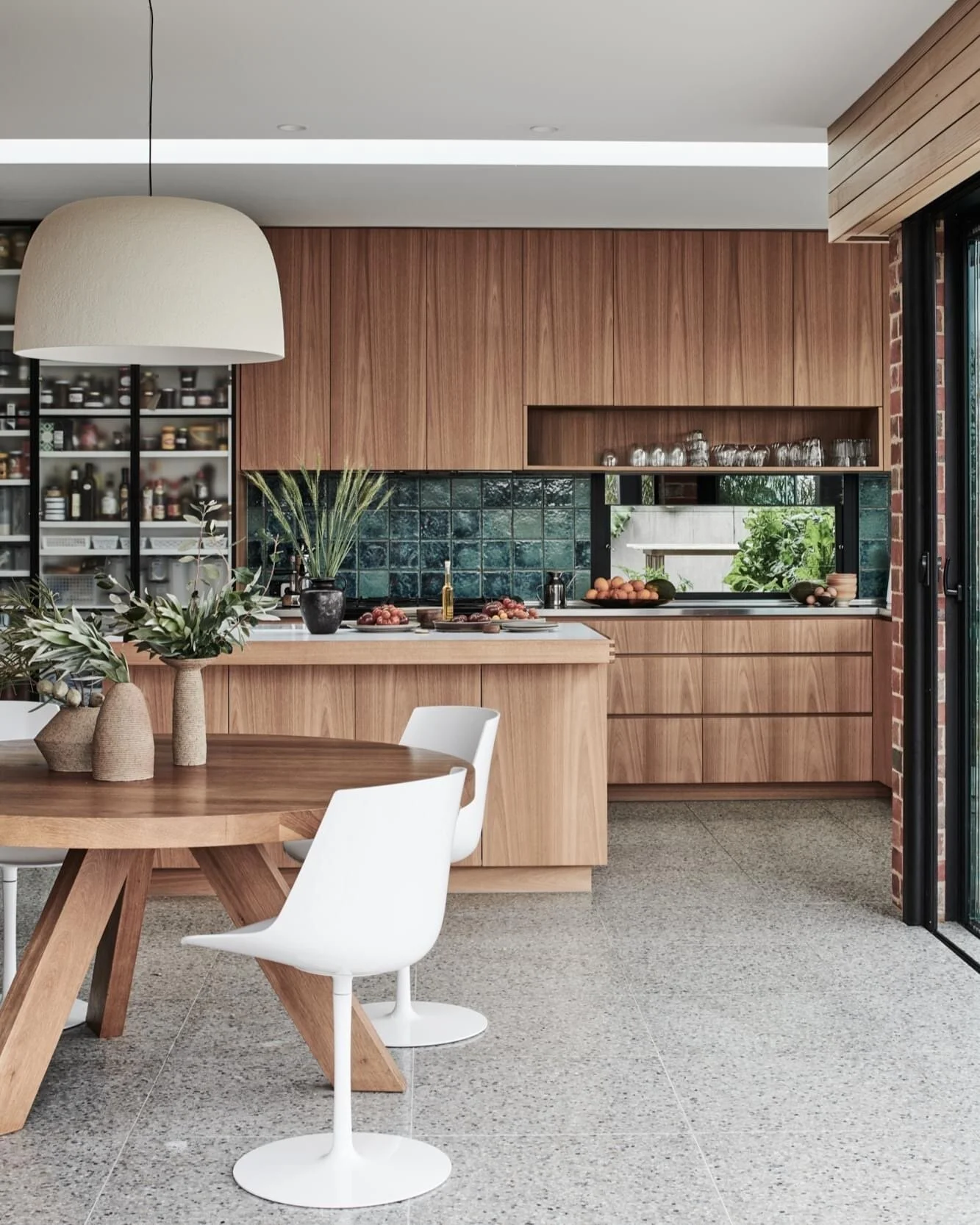 Moroccan zellige tiles in royal shades of green brings color &amp; life to this shared kitchen+dining space. 🪴