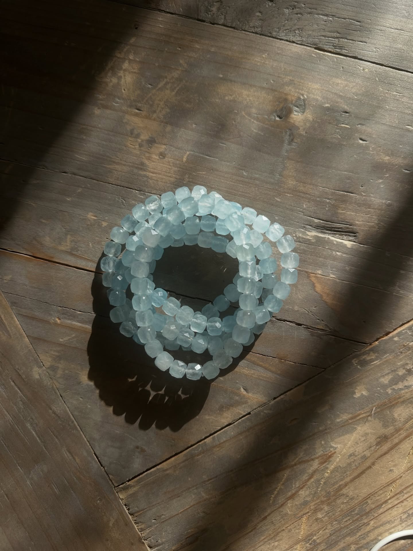 Ice Cube 🧊 
This faceted aquamarine bracelet brings tranquility, courage, and clear communication. Resembling of the calming energy of the ocean, it helps release anxiety and quiets the mind. It also facilitates closure and promotes mental clarity w