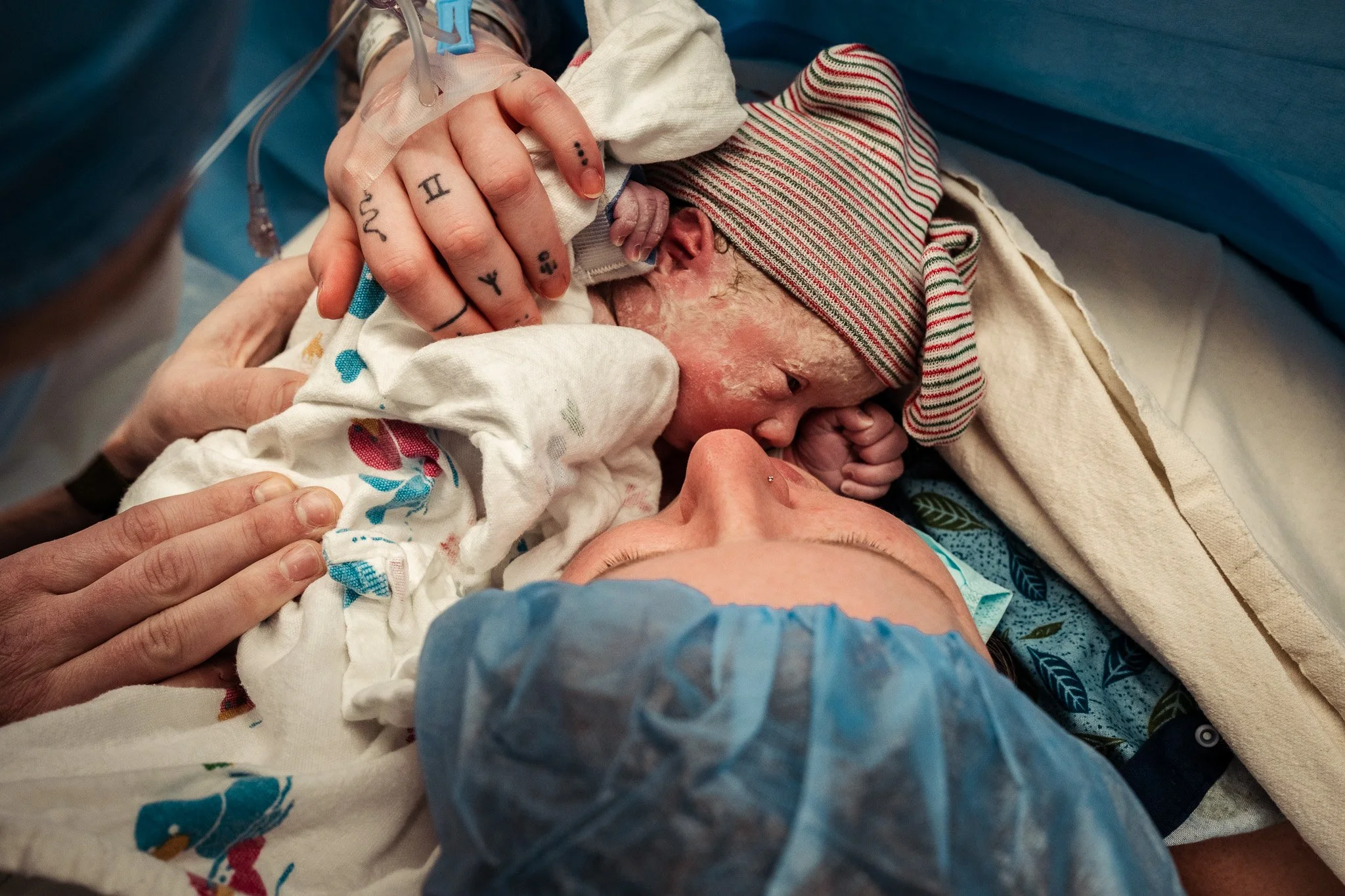 Photo of a mom doing skin-to-skin with her baby during a cesarean birth. Photo by Megan Peasley of Illuminated Birth.