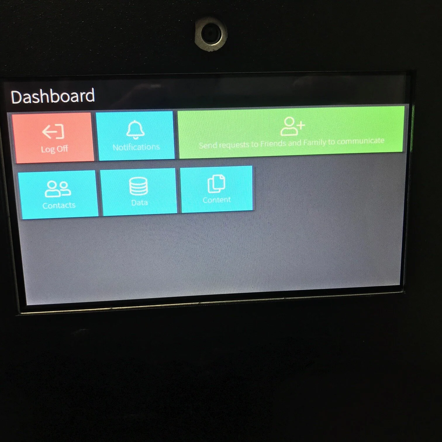 A vehicle dashboard screen displaying options including Log Off, Notifications, Send Requests to Friends and Family, Contacts, Data, and Content.