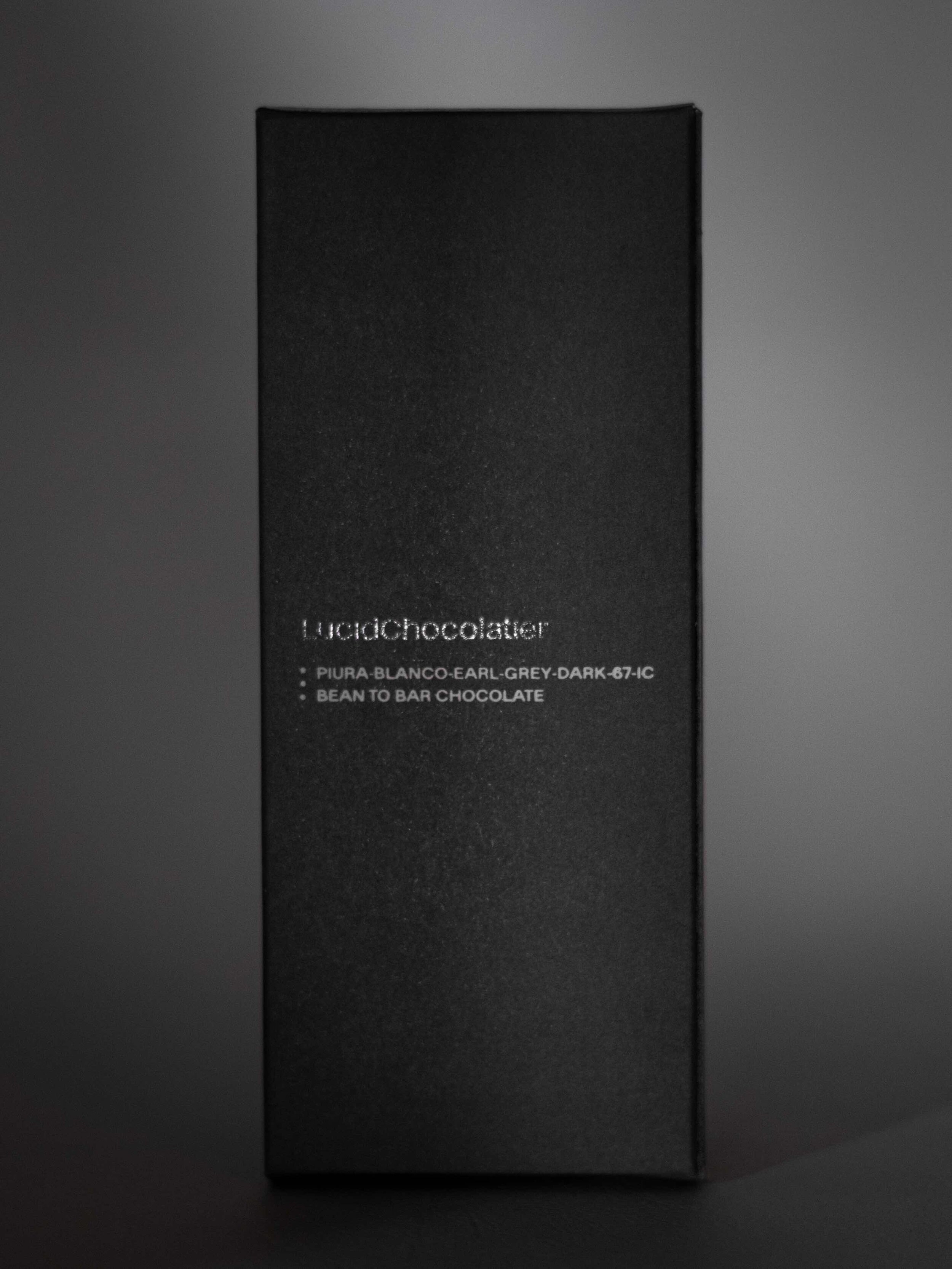 PIURA-BLANCO-EARL-GREY-DARK-67-IC   The delicate earl grey blend consisting of Bergamot, cornflowers, lemongrass and black tea has been added to cacao from Piura to compliment its existing fruitiness.