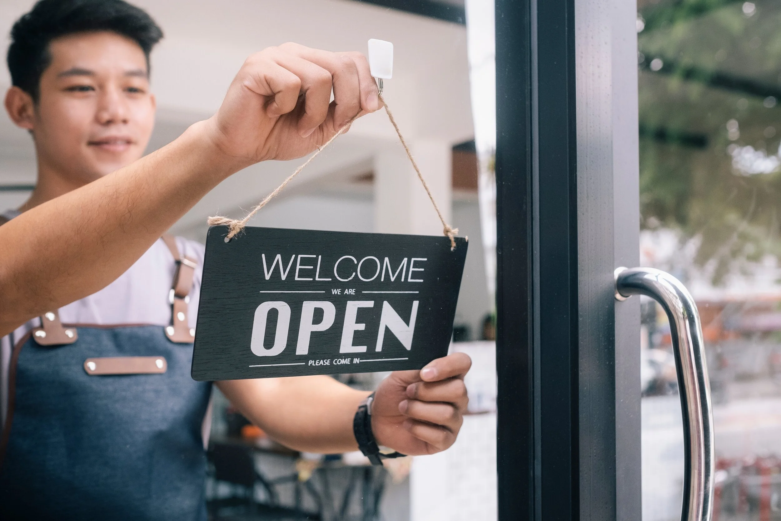 young-startup-coffee-cafe-owner-open-and-welcome-customer-new-small-business-owner_t20_wlxNKe.jpg