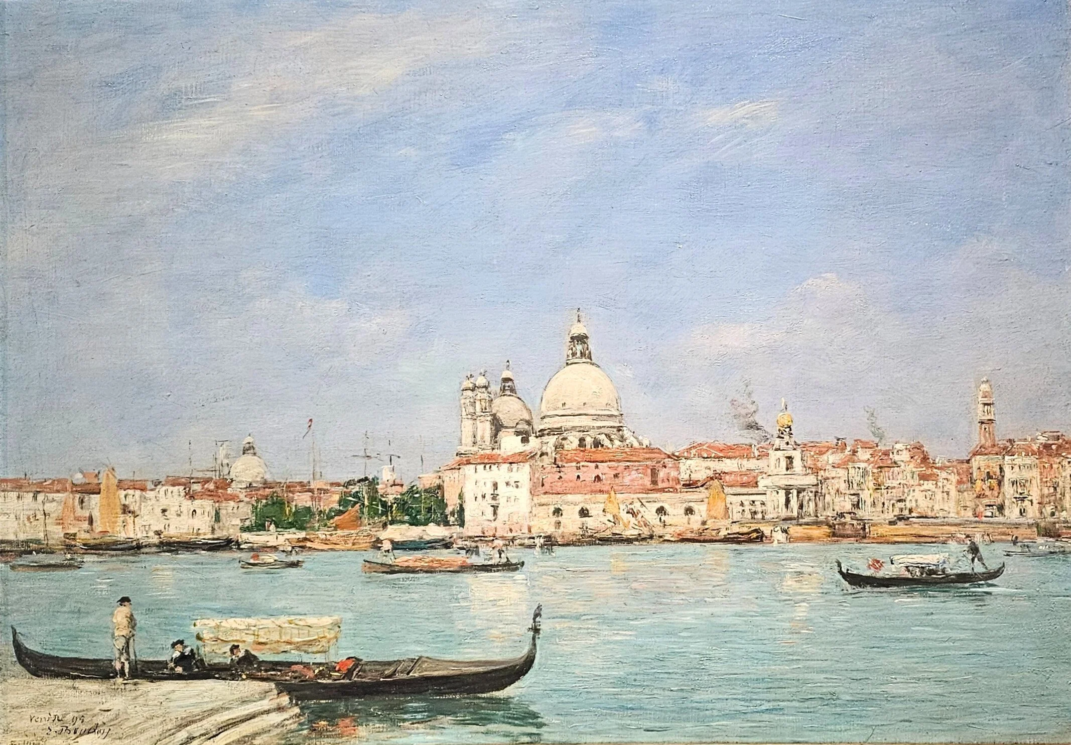 Venice lagoon with gondolas in the foreground and a domed basilica across the water.