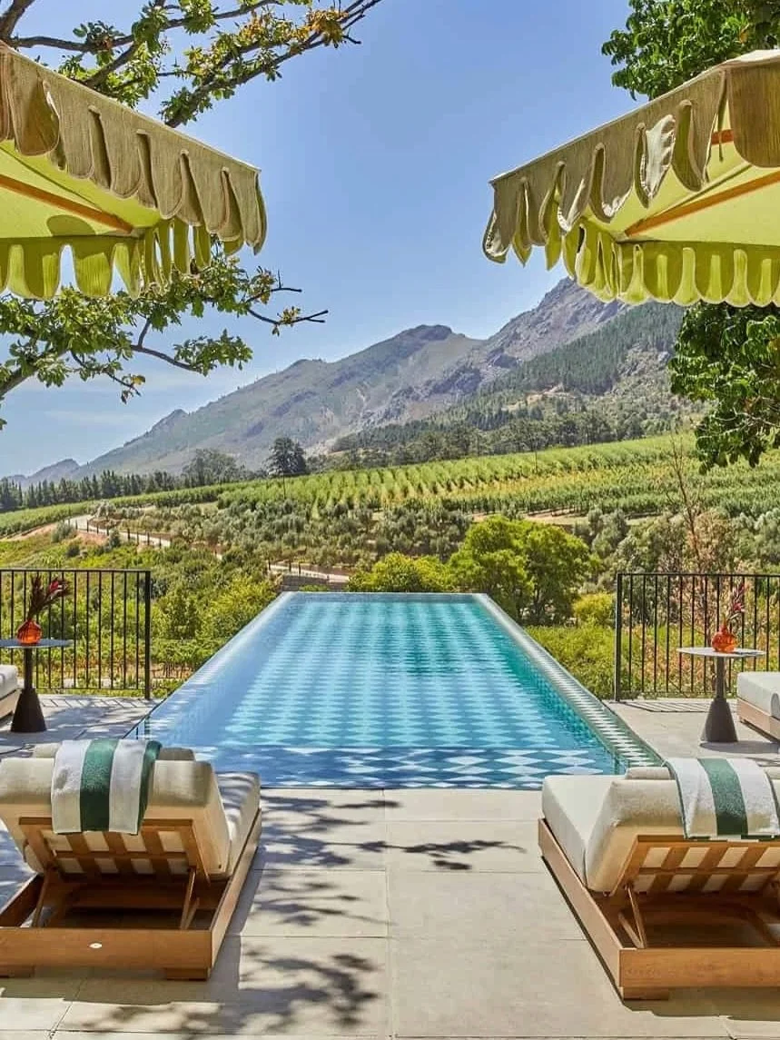Somewhere between the vines and the mountains, you will find @laresidencesa set within its own 30-acre estate in South Africa&rsquo;s Franschhoek Valley.

Peacocks wander the lawns, suites are layered with silk and antiques, and long, candlelit dinne