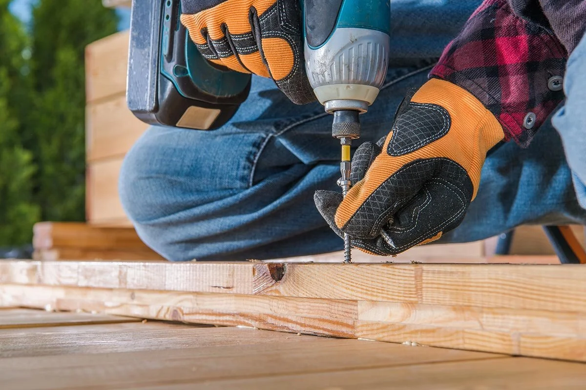carpenter-using-drill-driver-in-woodworking-small.jpg
