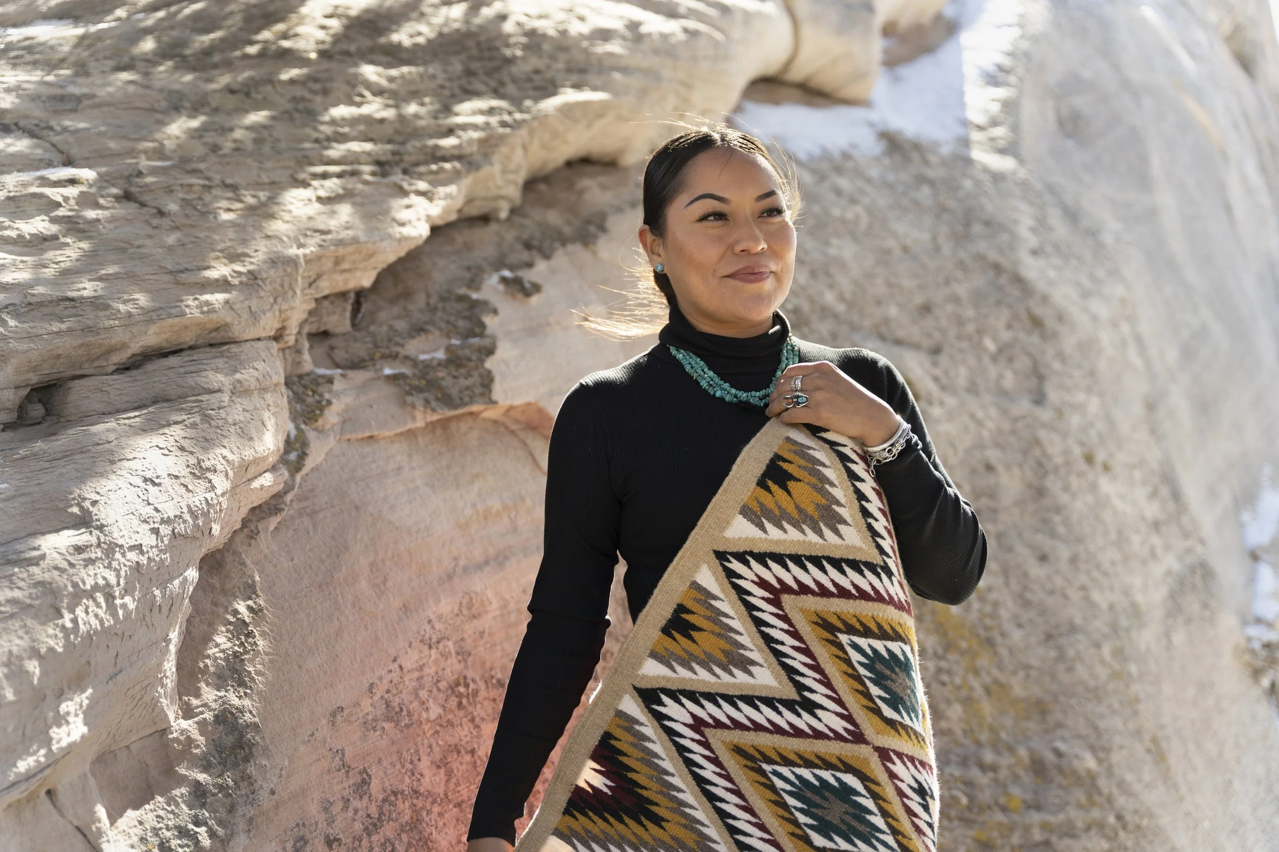 Tasheena Littleben, of Rock Point, Arizona began weaving Diné rugs as a little girl in Shiprock, AZ in the Diné Nation. After years away from the practice, she returned to it during the pandemic. Littleben processes the raw wool, colors it with natur