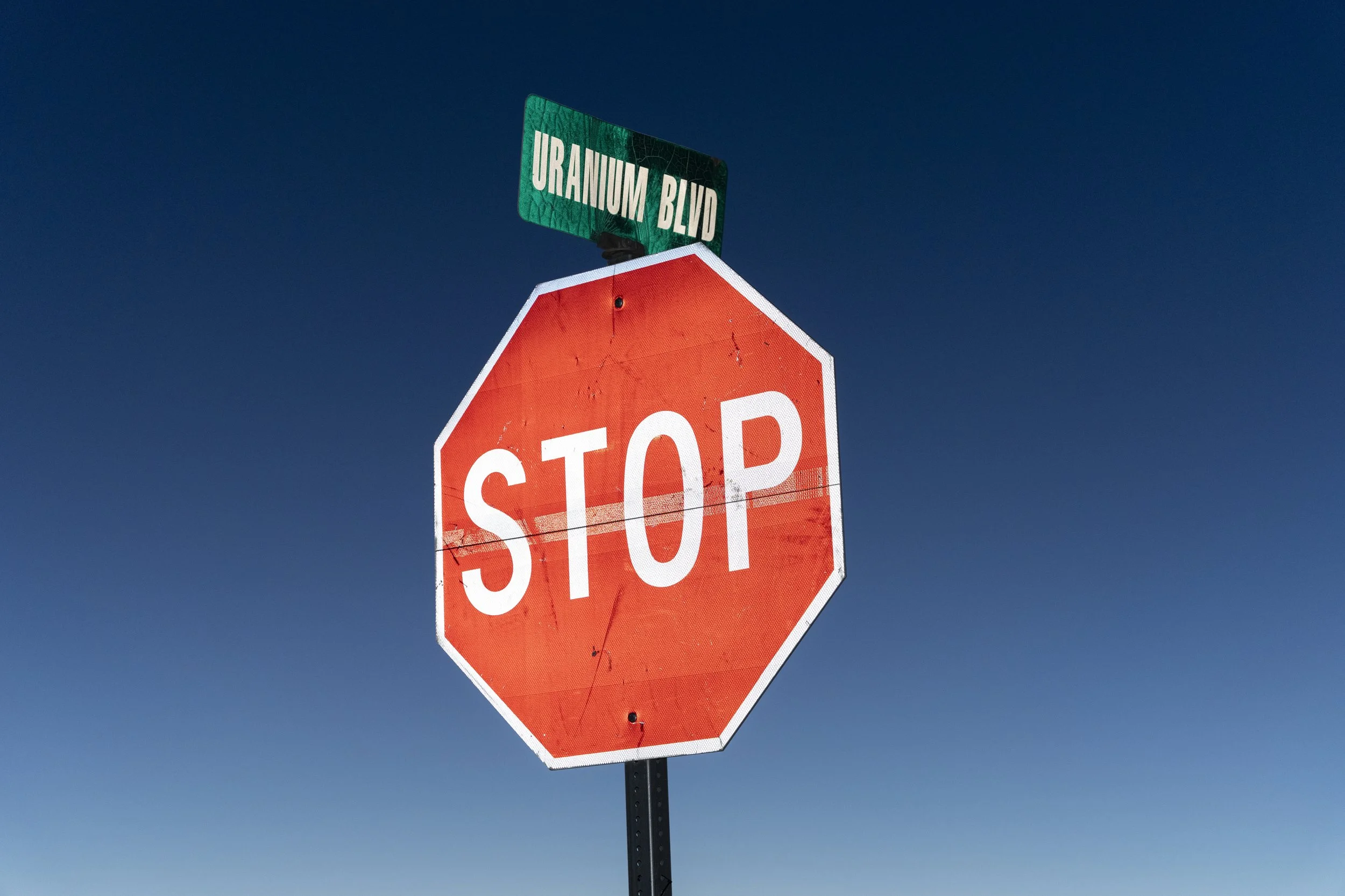 Visual reminders of uranium mines dot the streets of Shipwreck, Arizona. Because of high levels of uranium in the drinking water, wells can no longer be used for households, livestock, or agriculture.