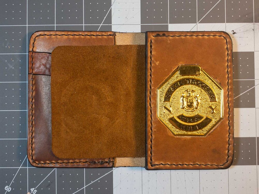 Custom badge wallet. Holds two - Seelye Leather Works