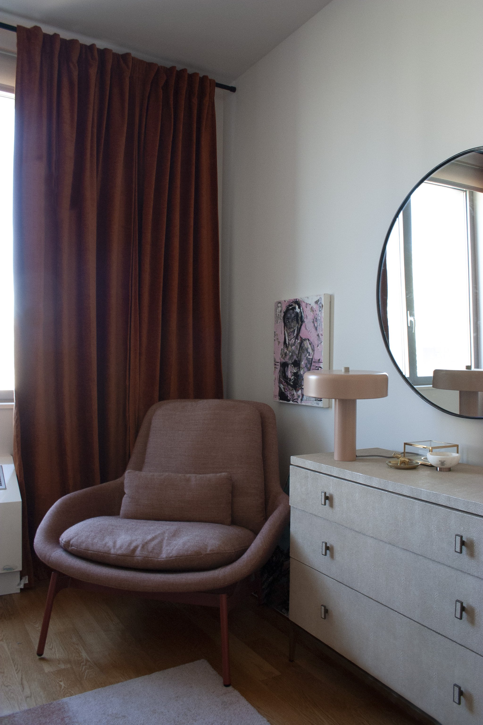 The bedroom chair is from Blu Dot and sits besides the Owner’s own artwork.