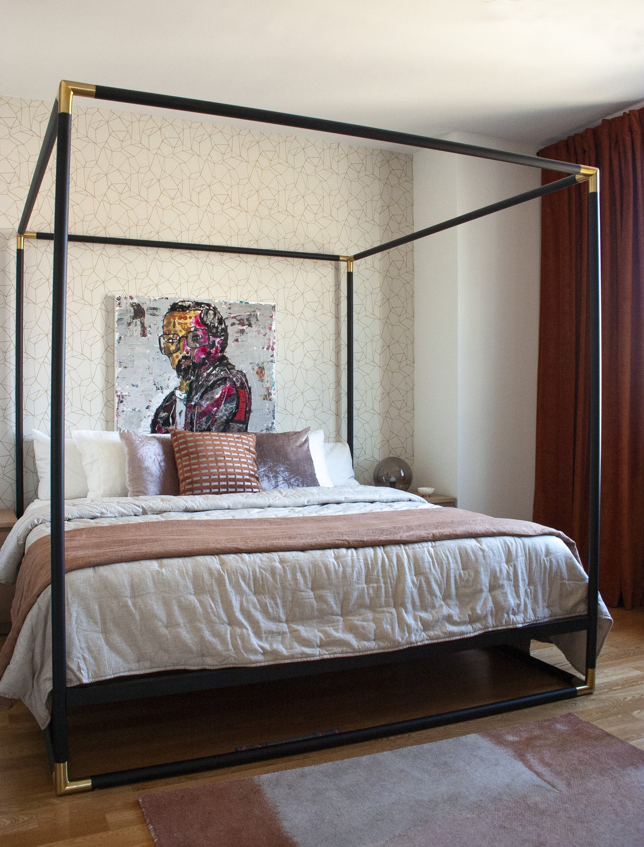 In this rental apartment, peel and stick wallpaper was used to add interest in the bedroom.