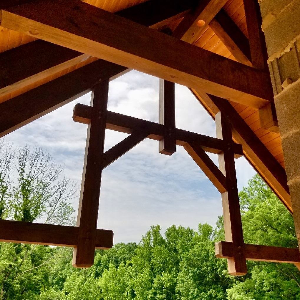 Timber frame detail on the porch. What a view! #timberframe #loghome #engineeredlogs #logandtimberframe