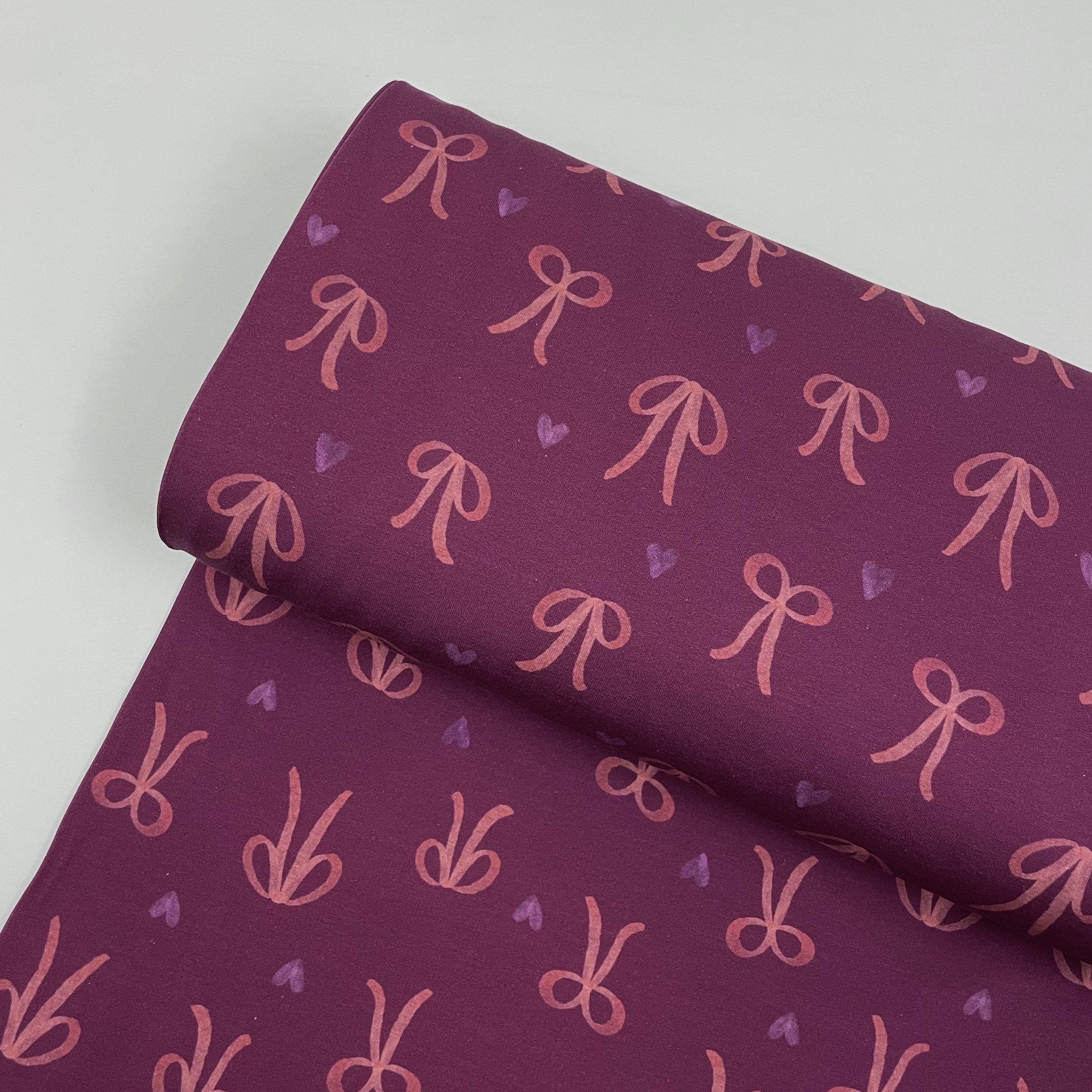 Hey Sew Sister - Bows and Hearts - Printed Super Soft Lightweight Sweatshirting Fabric - Wine and Pink 1.jpeg