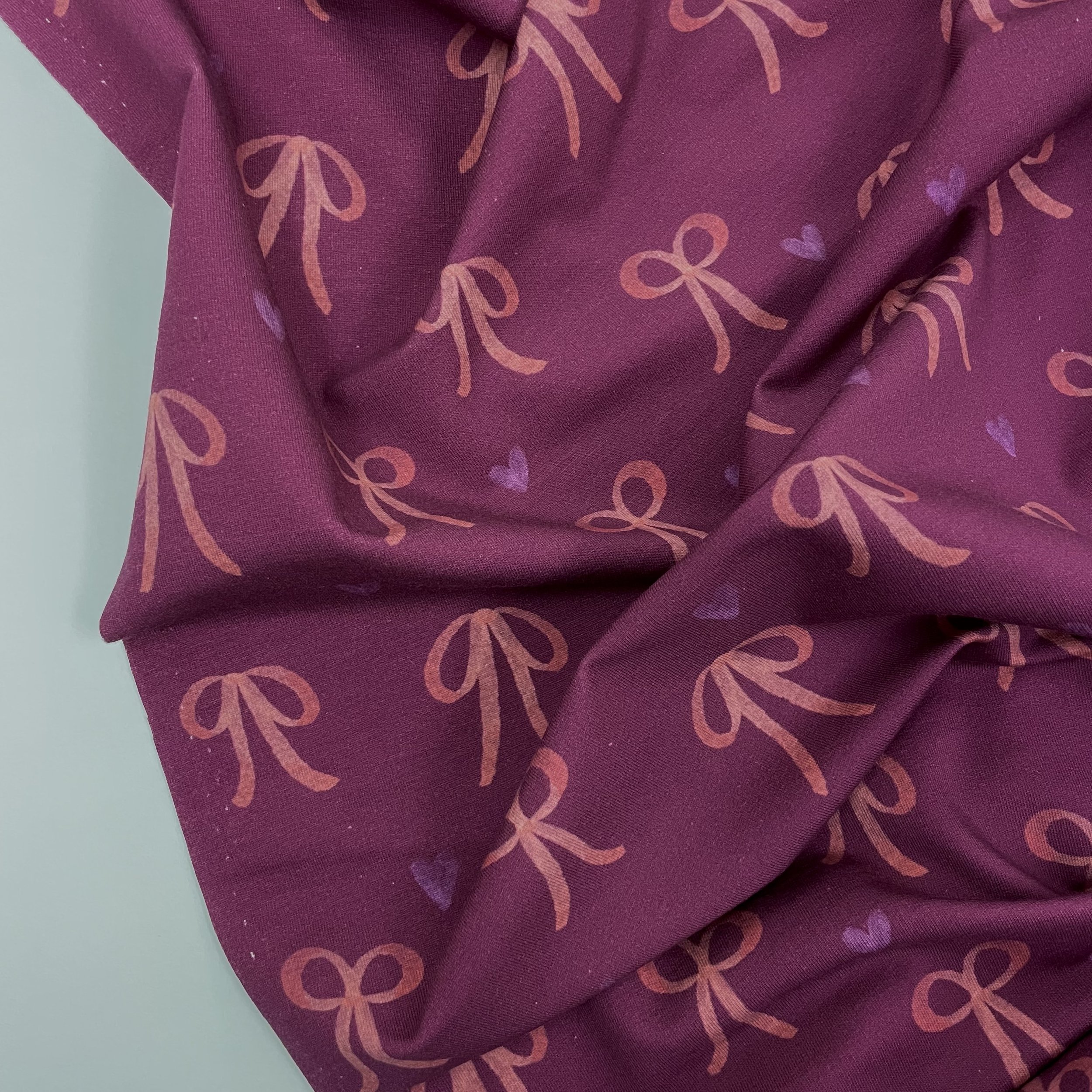 Hey Sew Sister - Bows and Hearts - Printed Super Soft Lightweight Sweatshirting Fabric - Wine and Pink 2.jpeg