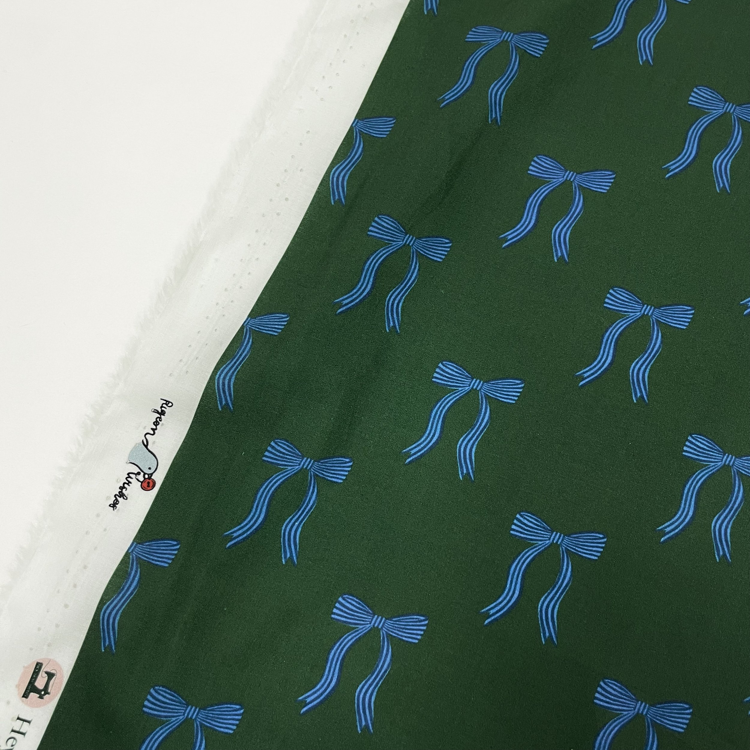 Hey Sew Sister - Pigeon Wishes - Adorn You - Bow Print Fabric - Cotton Lawn Poplin Dressmaking Fabric - Green and Blue - Leaf 1.jpeg