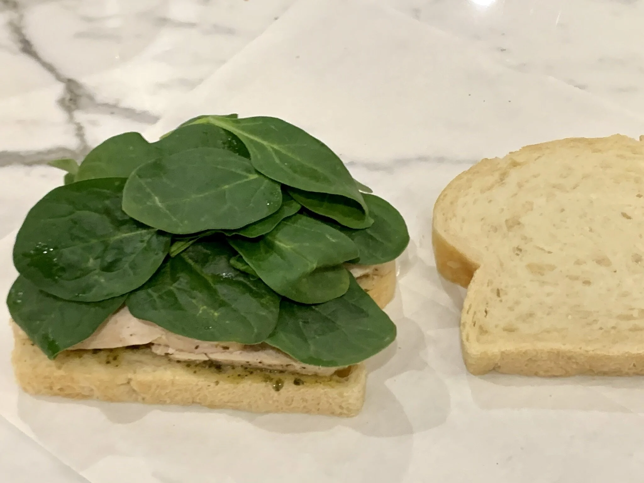 c) Layer fresh spinach.