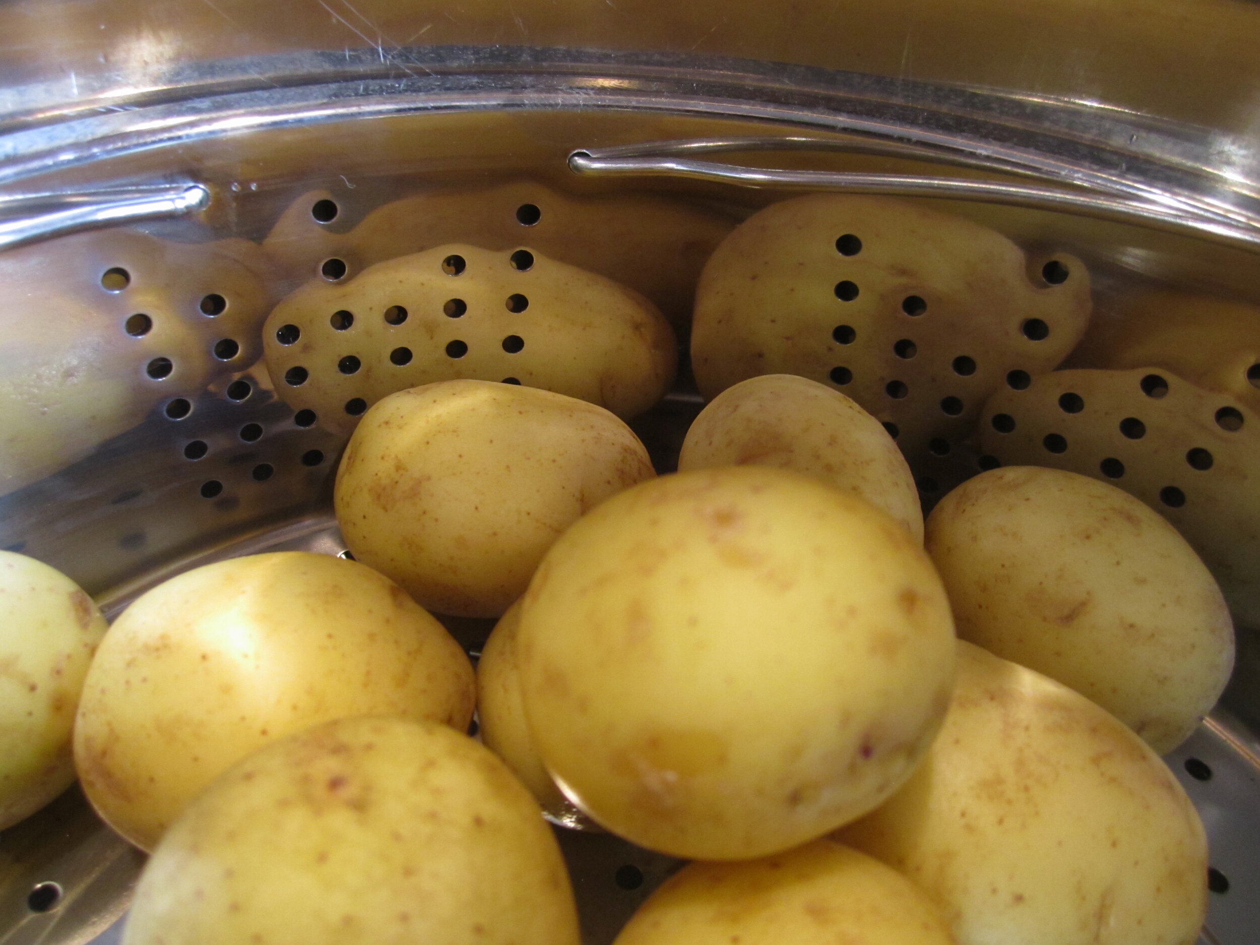 c) Potatoes in basket.