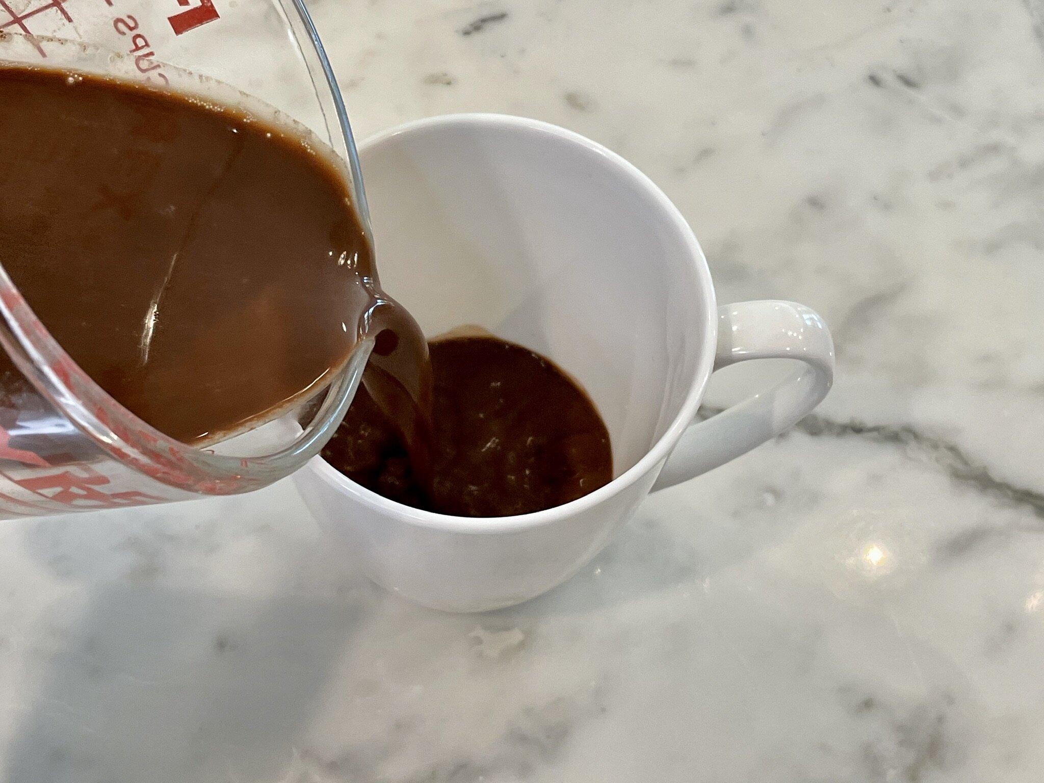 a) Pour half into mug.