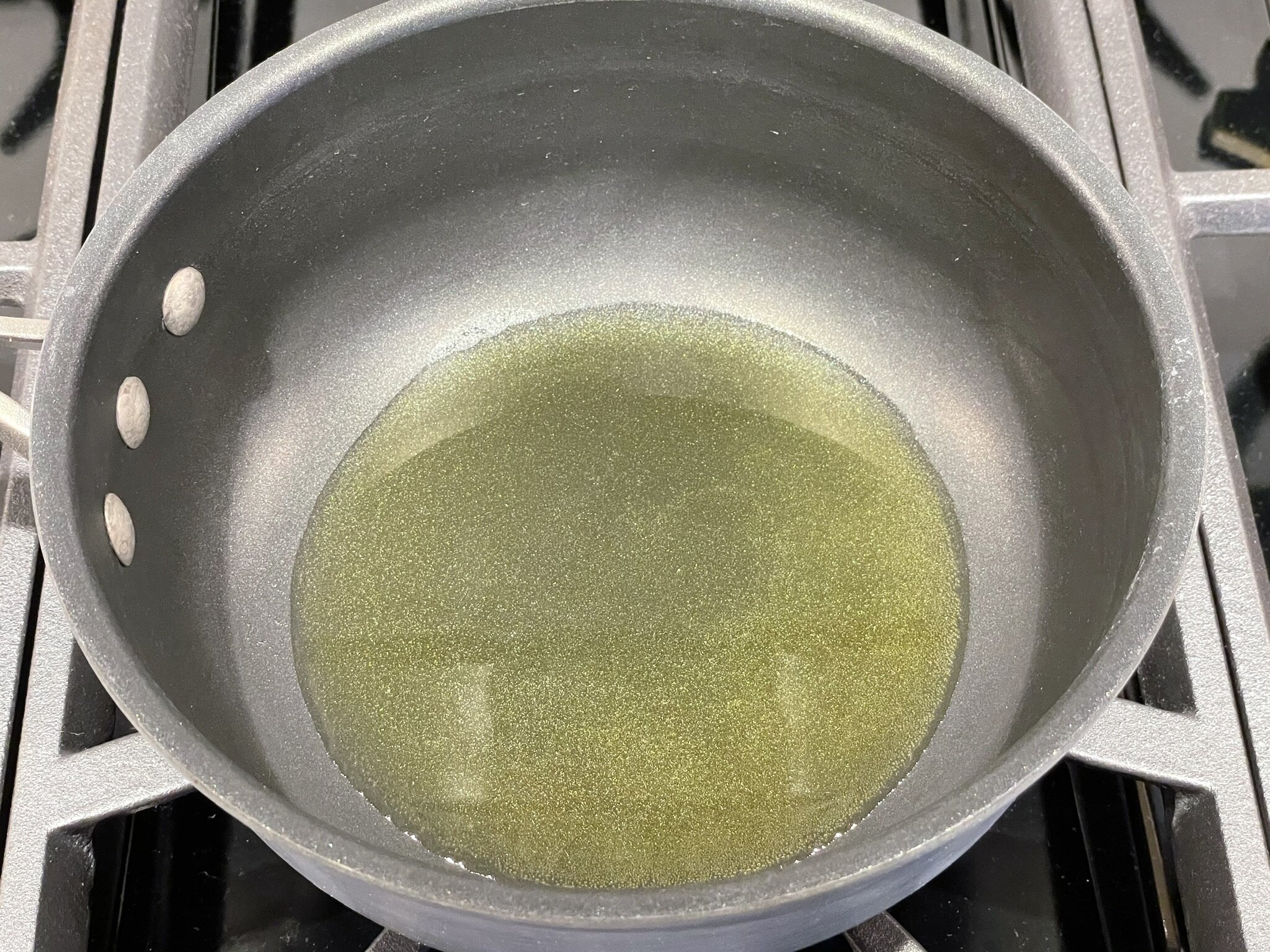 Heat olive oil.