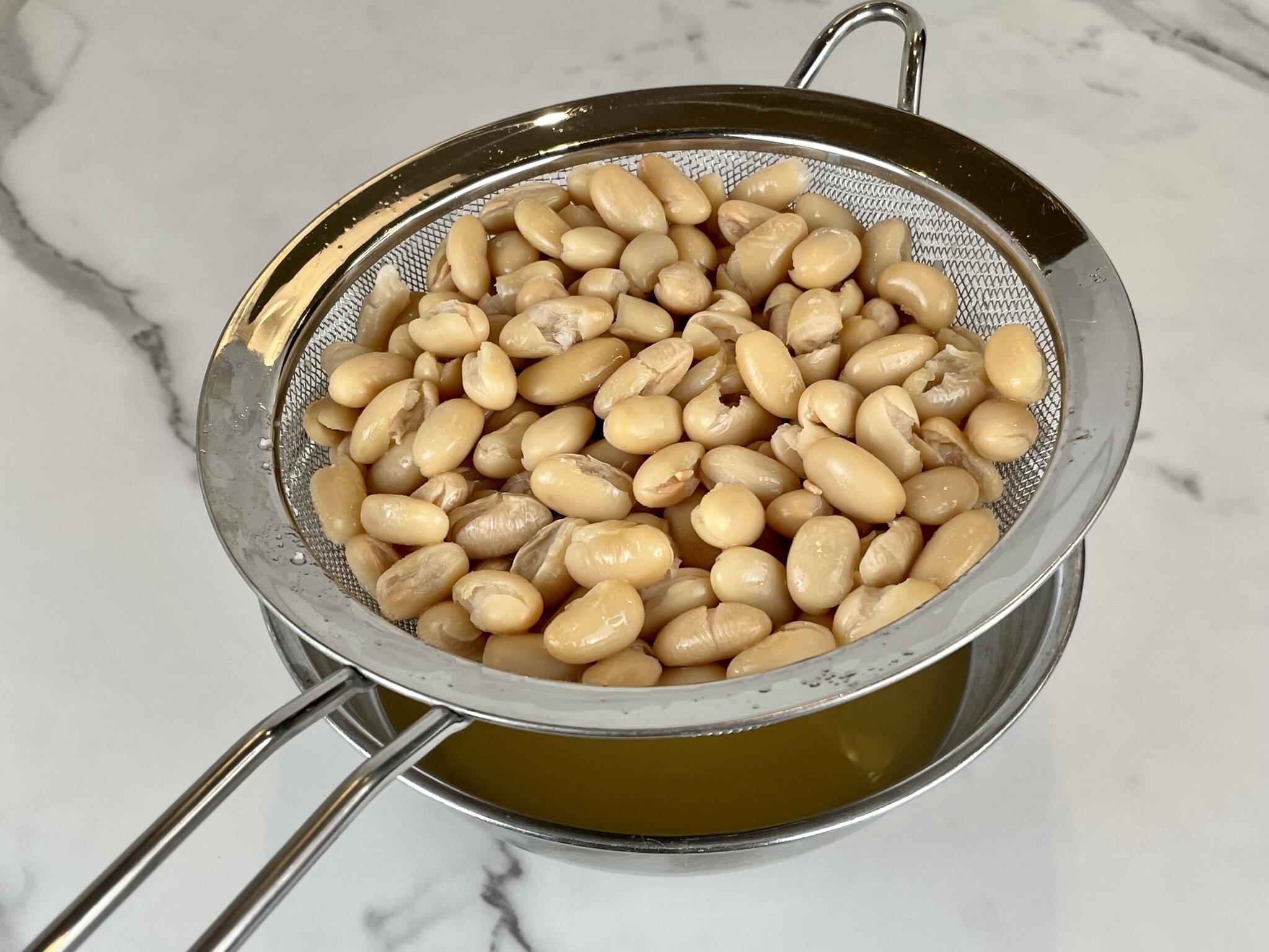 Drain canned liquid from beans.