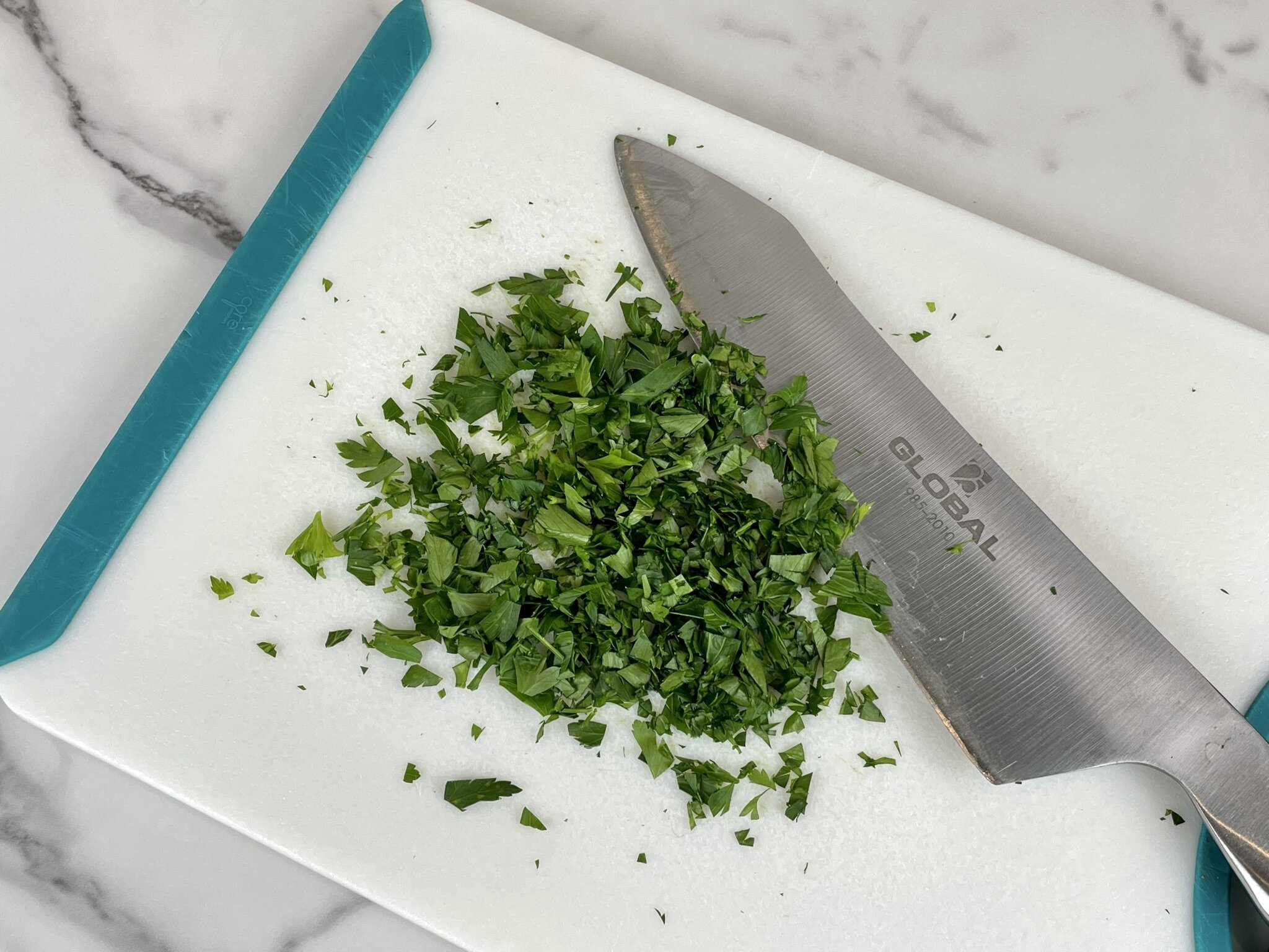 Chop fresh Italian parsley.