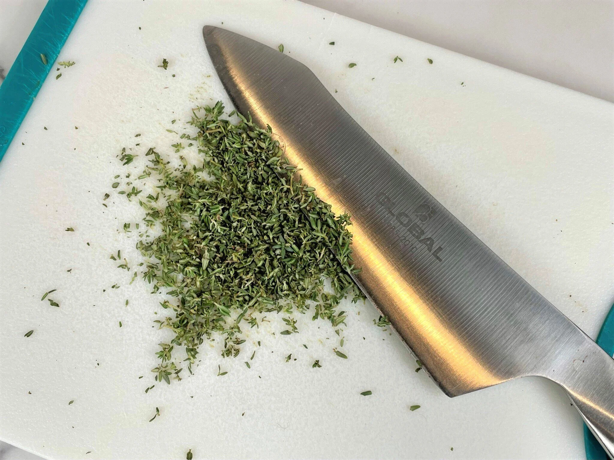 Chop fresh thyme.