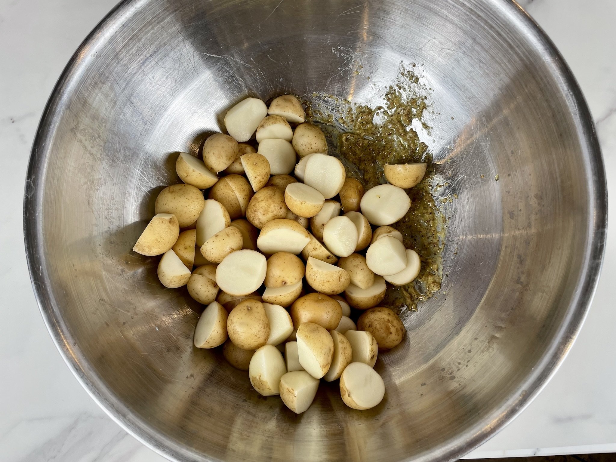 Add potatoes to marinade.