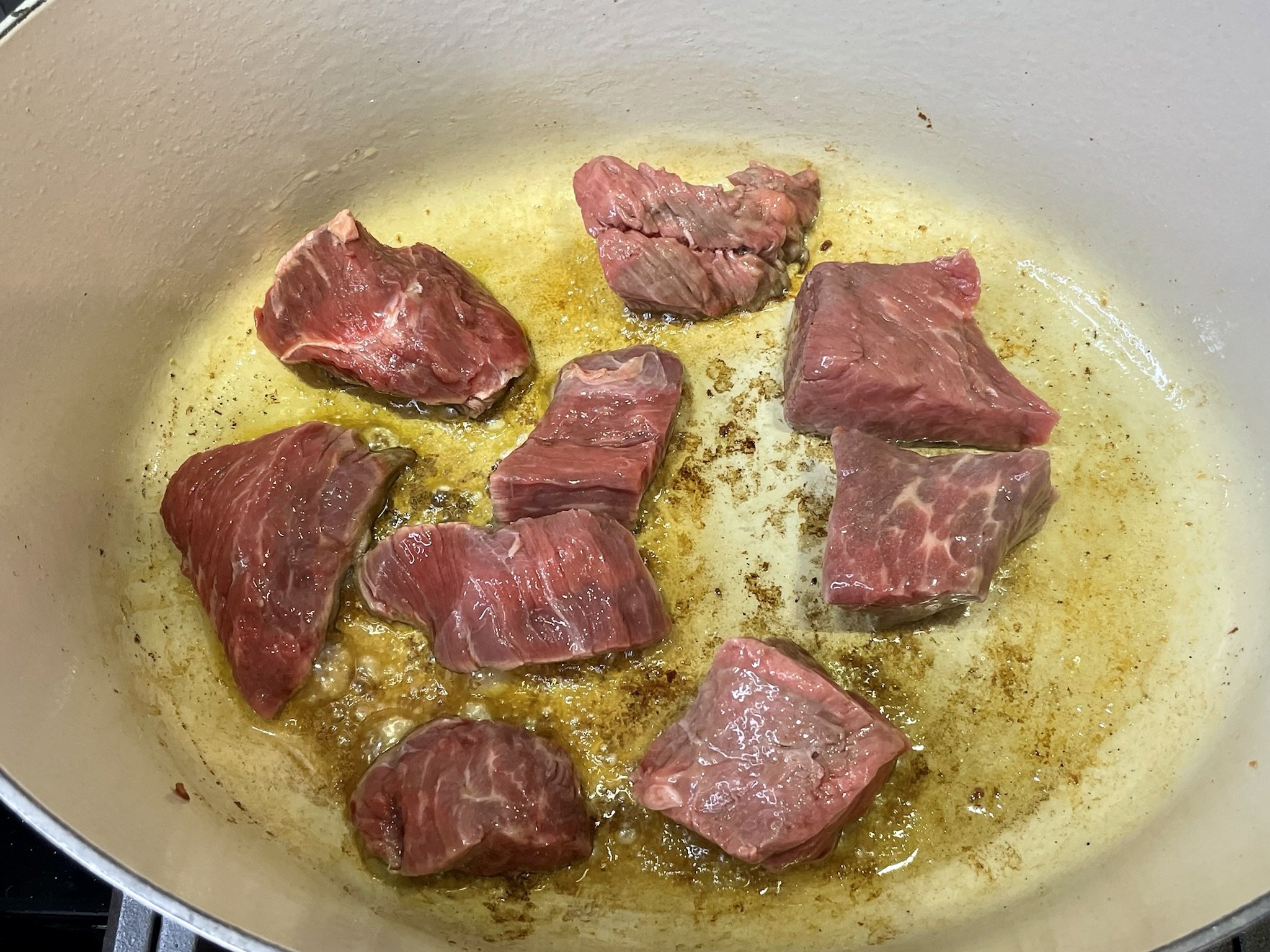 Add 1/3 of cubed beef. 