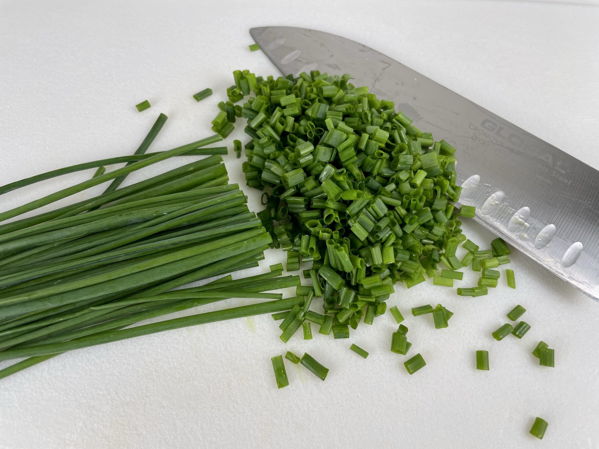 Finely chop chives.