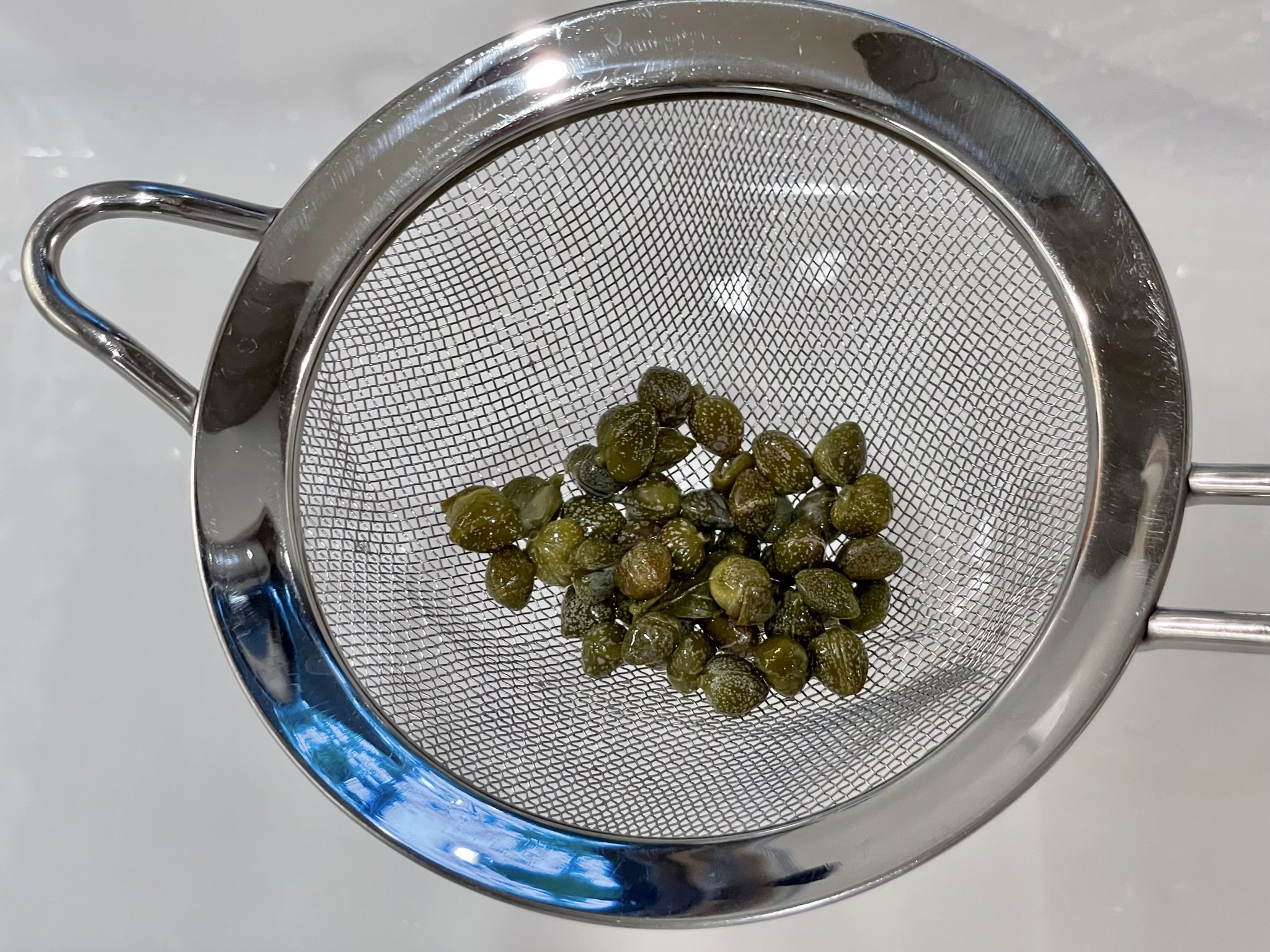 Drain capers.