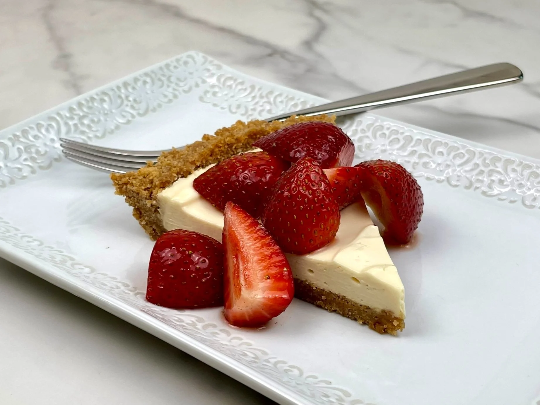 Topping spooned on pie.