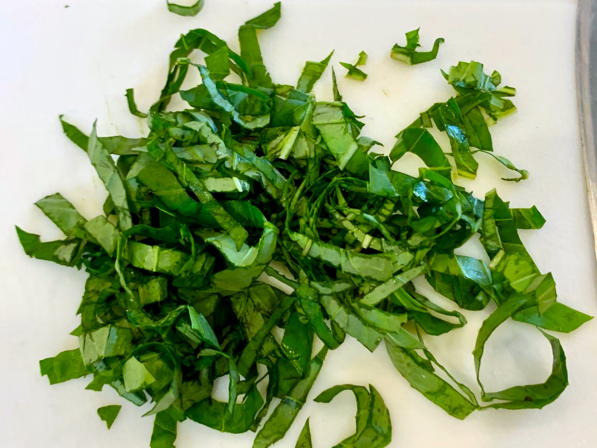Thinly sliced basil.