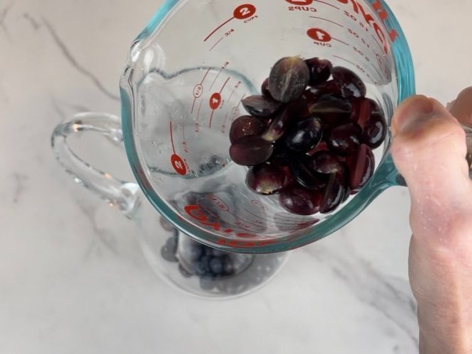 Add halved grapes.