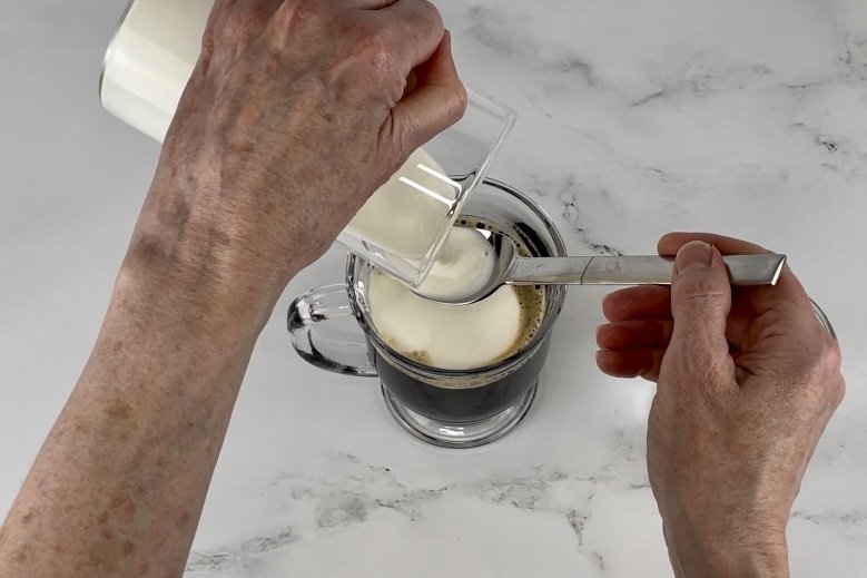 Pour cream over spoon.