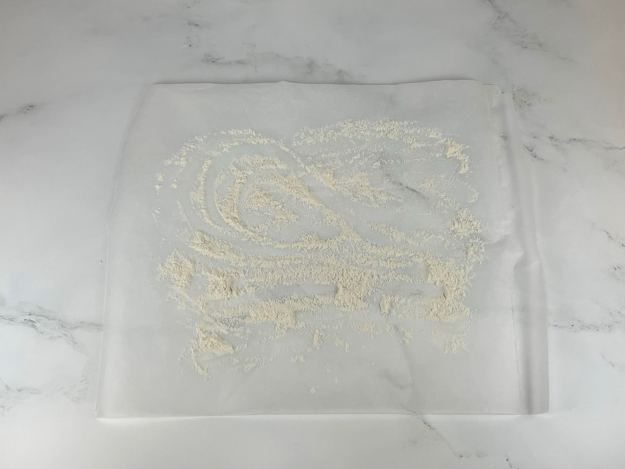 Flour on parchment.