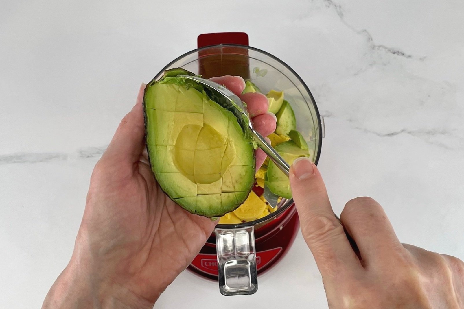 Scoop out avocado.