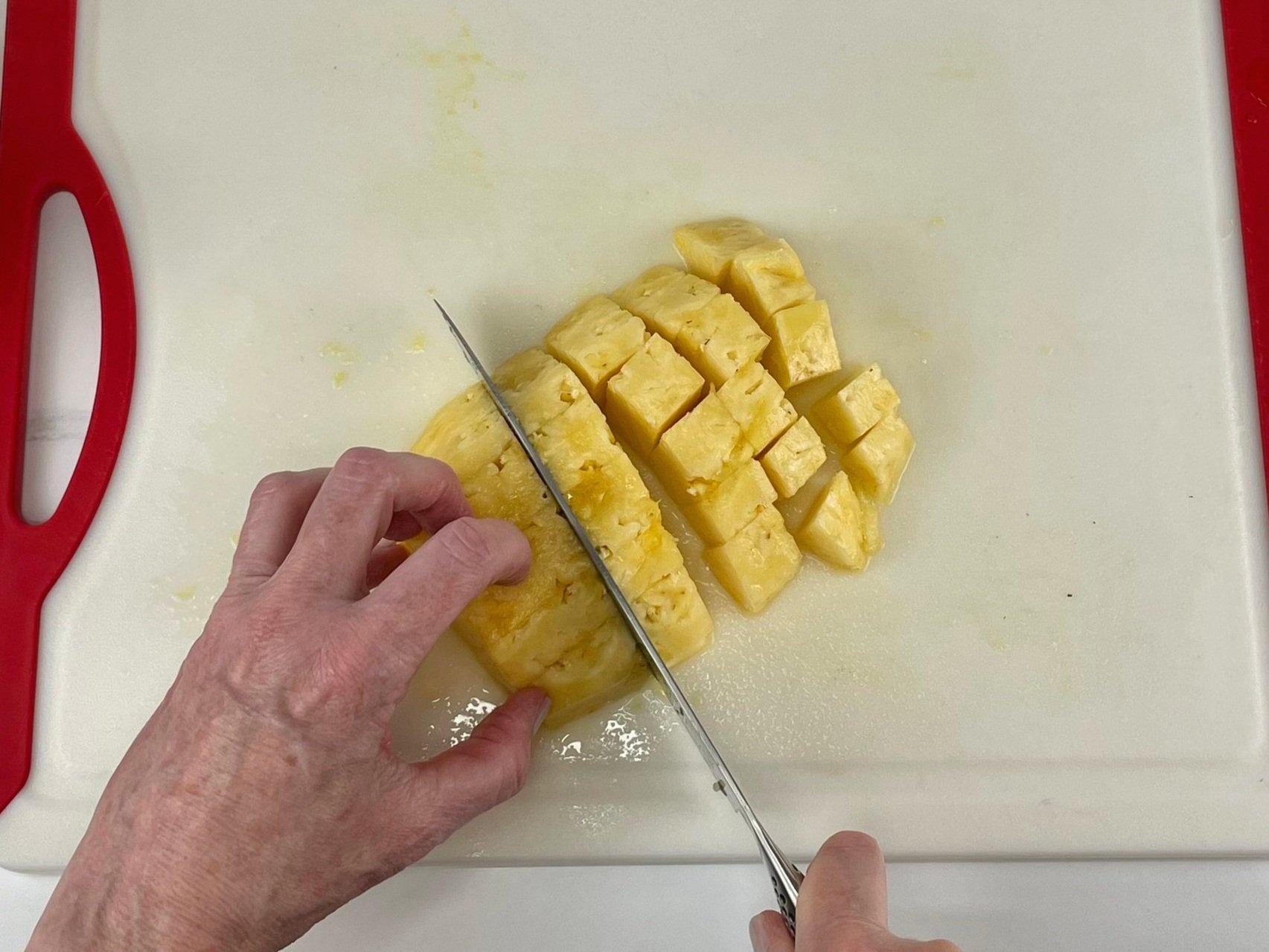 Cut fresh pineapple.