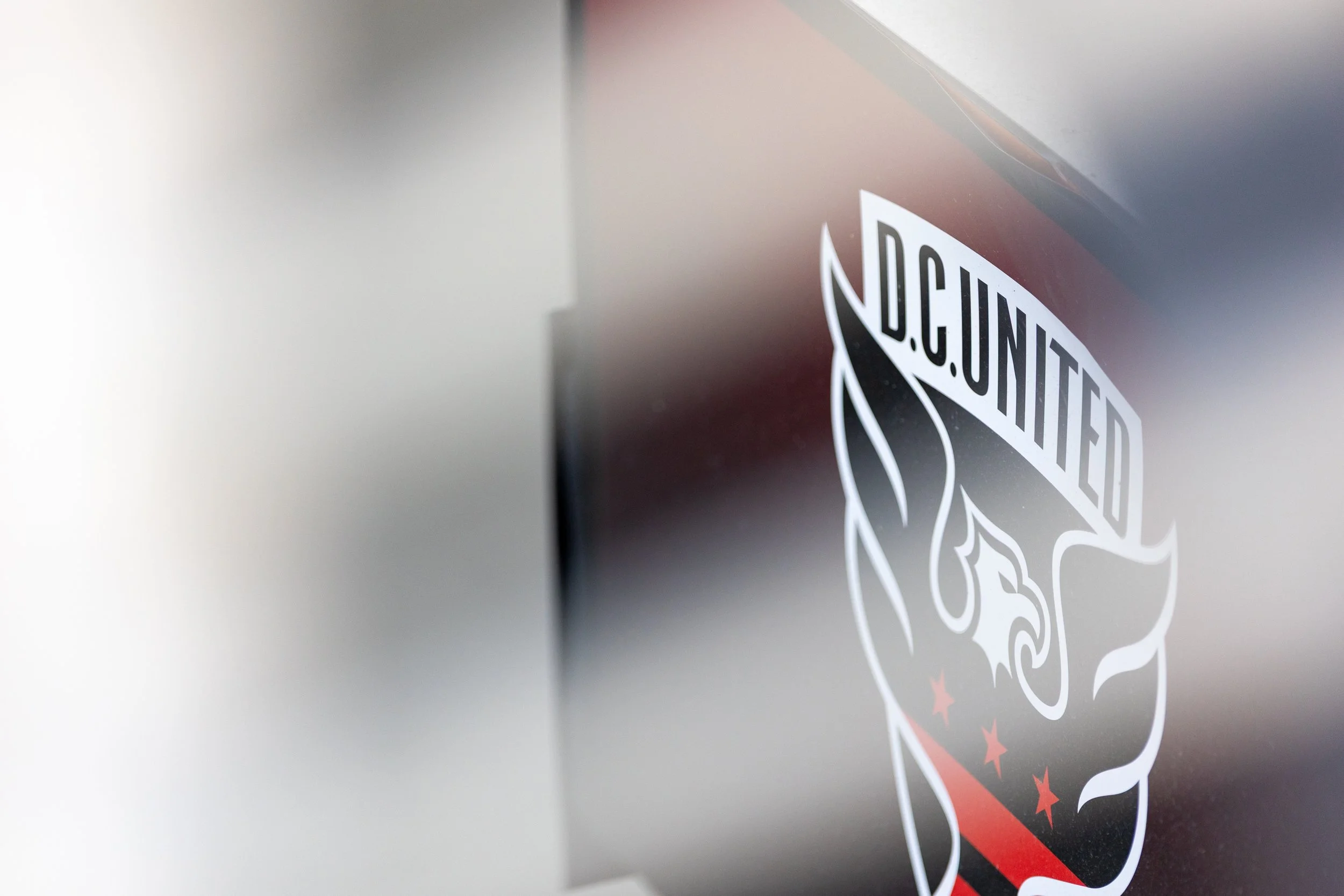 Detail shot of of the DC United logo through a railing at Audi Field on Sept. 13, 2025.