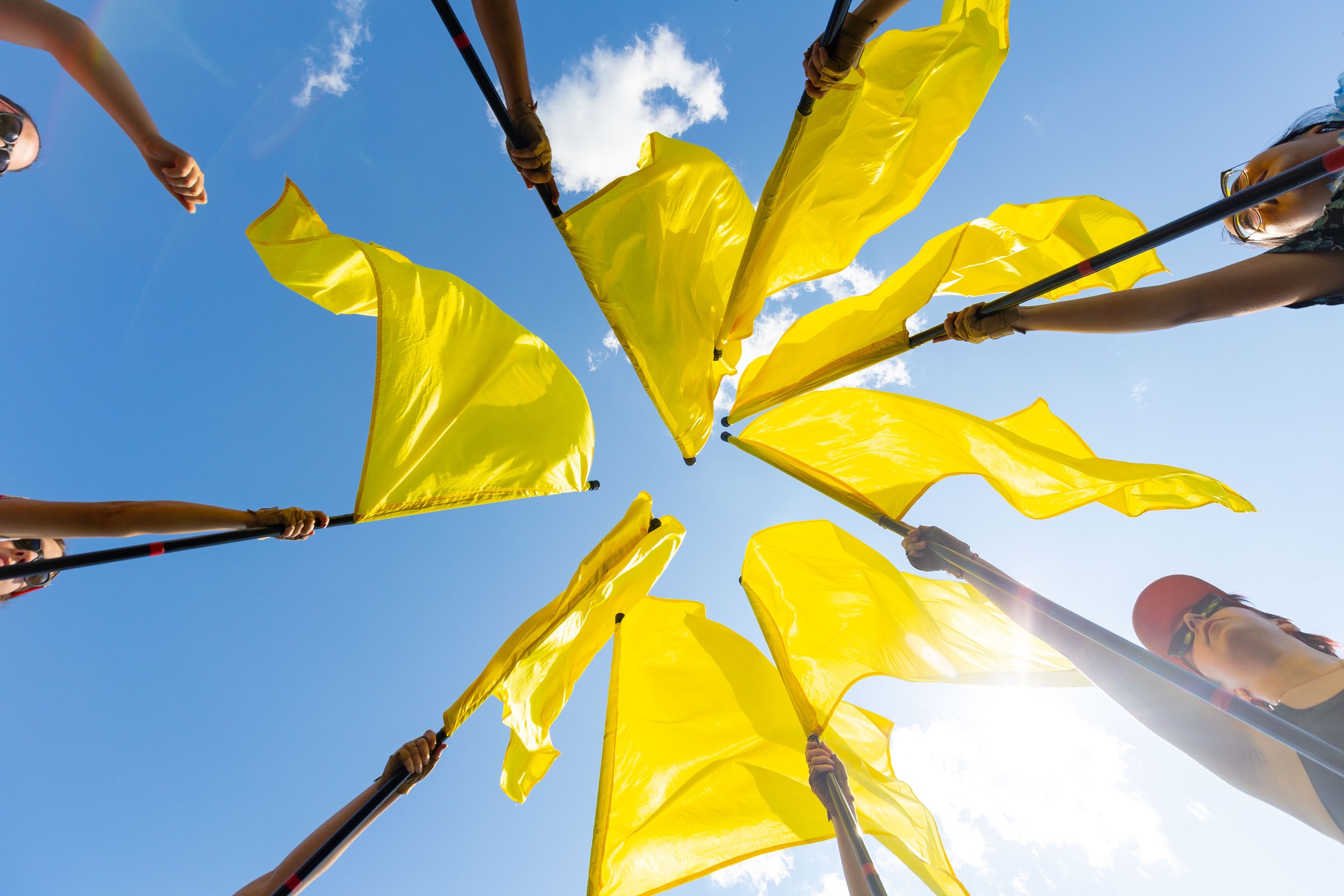 The Mighty Sound of Maryland color guard raises their flag during rehearsal on Aug. 2, 2024 in College Park, Md.