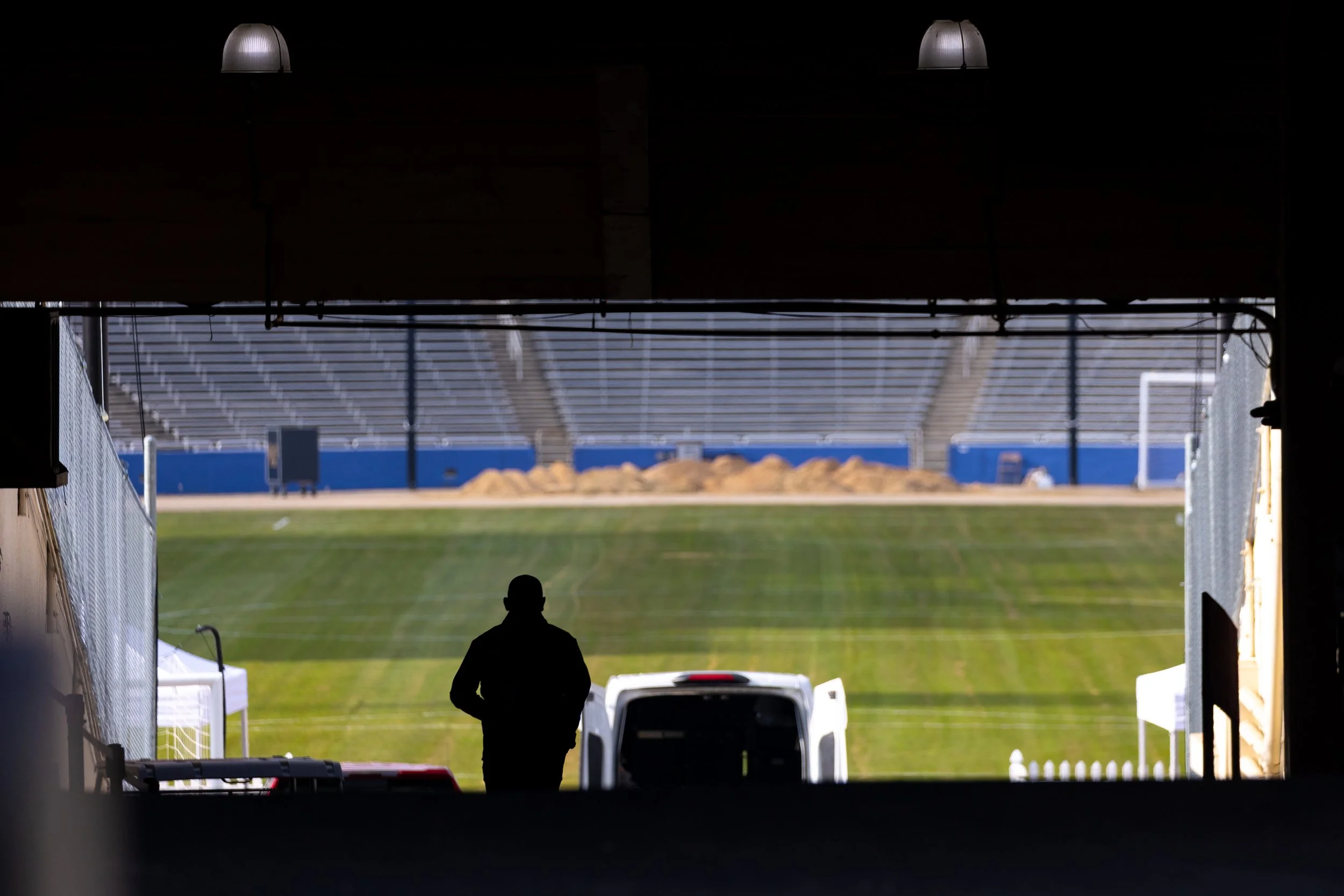 Silhouette of a man walking down Cotton Bowl Stadium's entrance ahead of DC Power FC's match against Dallas Trinity FC at Cotton Bowl Stadium in Dallas, Tx., on Dec. 6, 2025.